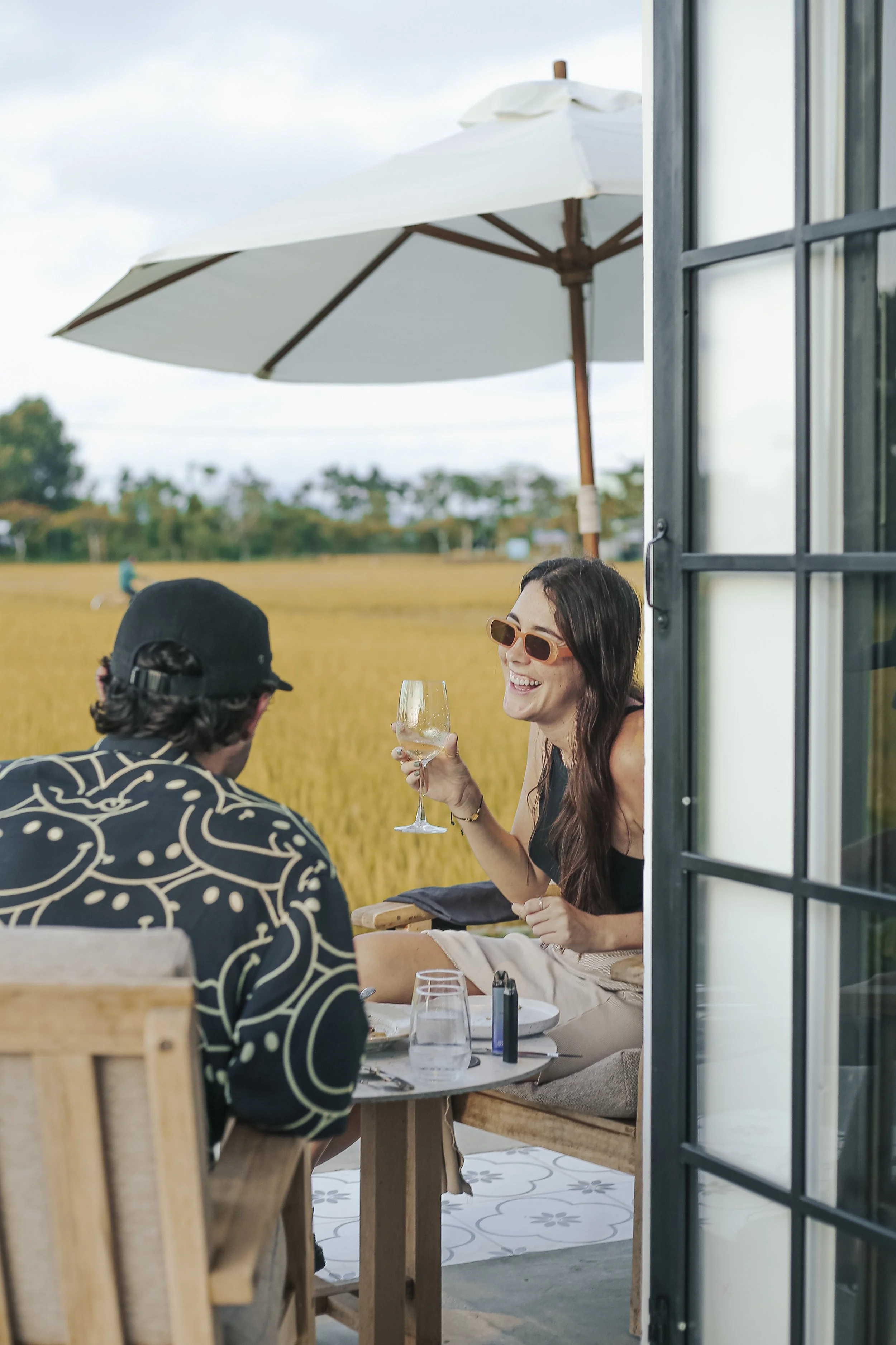 friends-enjoying-drinks-rice-fields-hoi-an.jpg