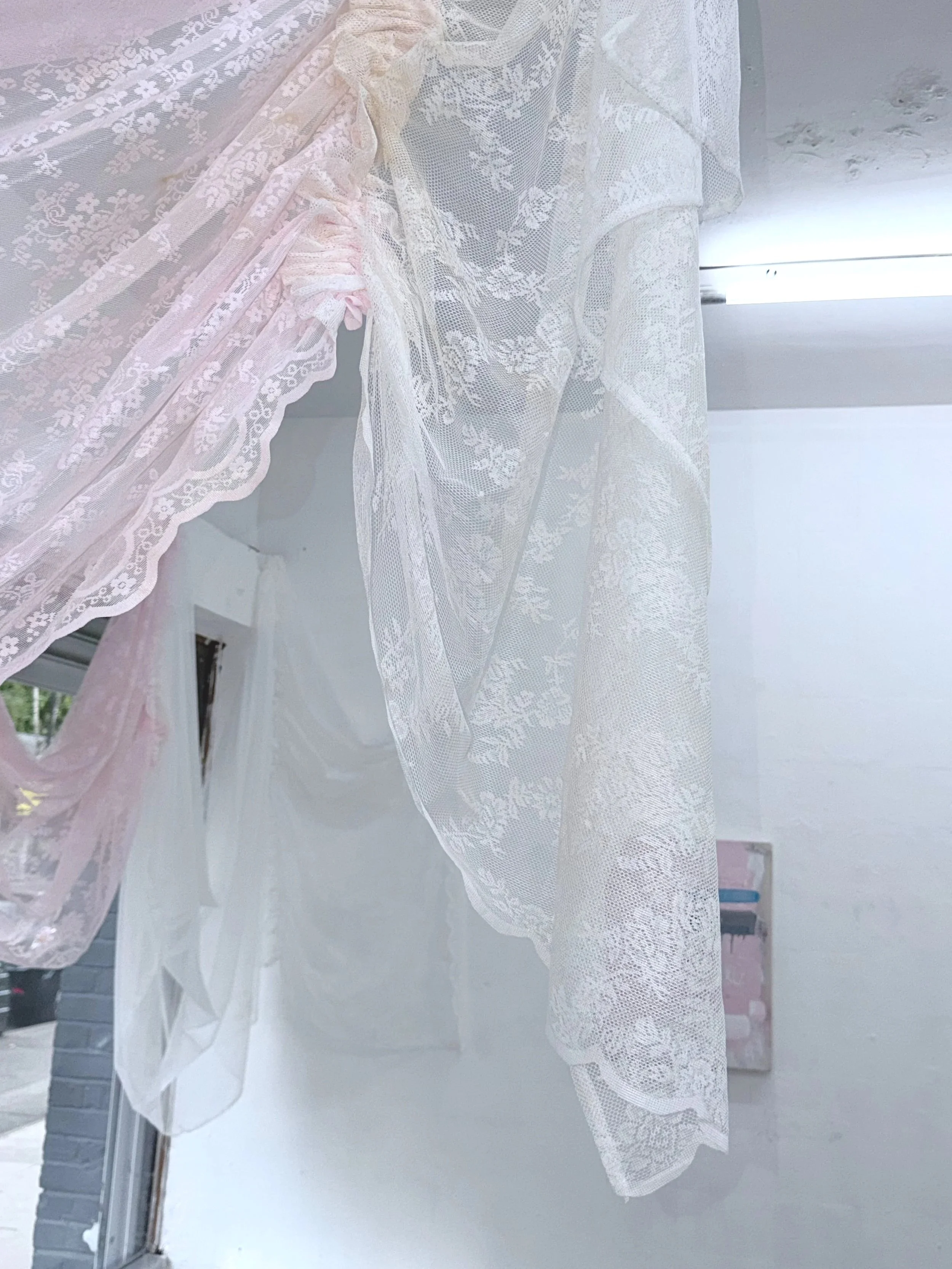 VEIL (2026) Polyester lace voile curtain panels, polyester sewing thread, black tea stain, salt, incense ash
