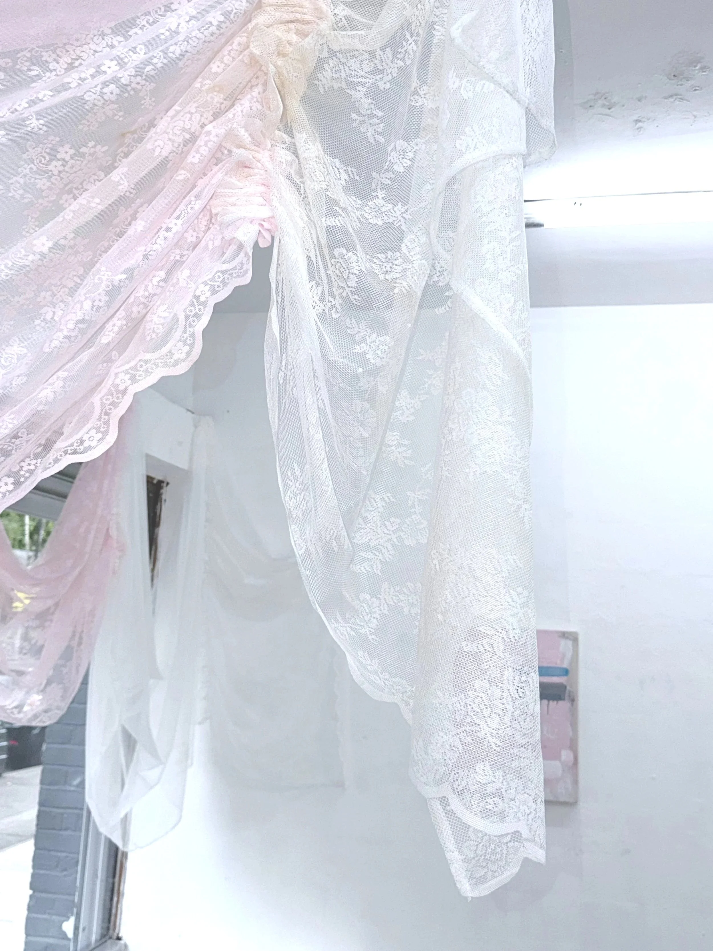 VEIL (2026) Polyester lace voile curtain panels, polyester sewing thread, black tea stain, salt, incense ash
