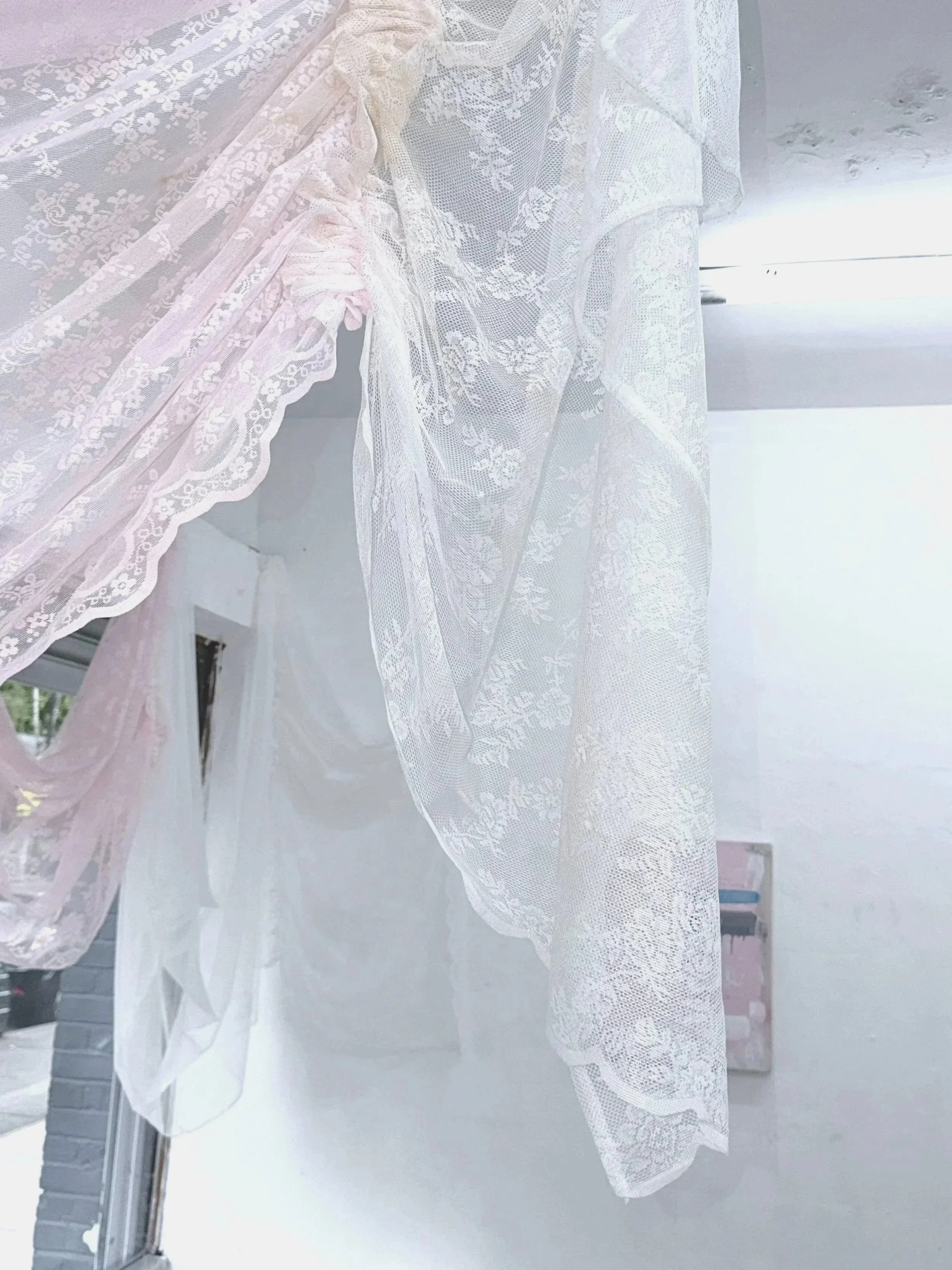 VEIL (2026) Polyester lace voile curtain panels, polyester sewing thread, black tea stain, salt, incense ash
