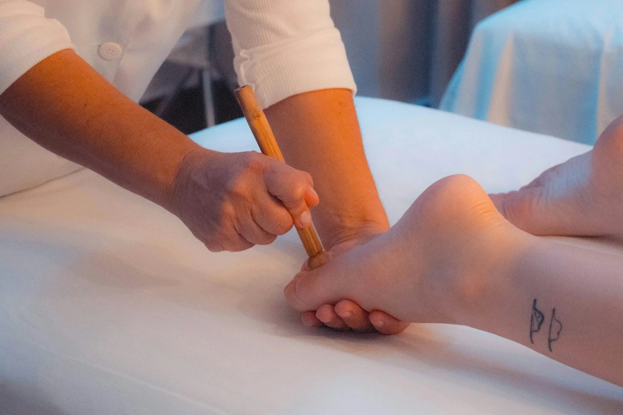 Podiatrist examining a patient’s foot during diabetic foot care treatment.