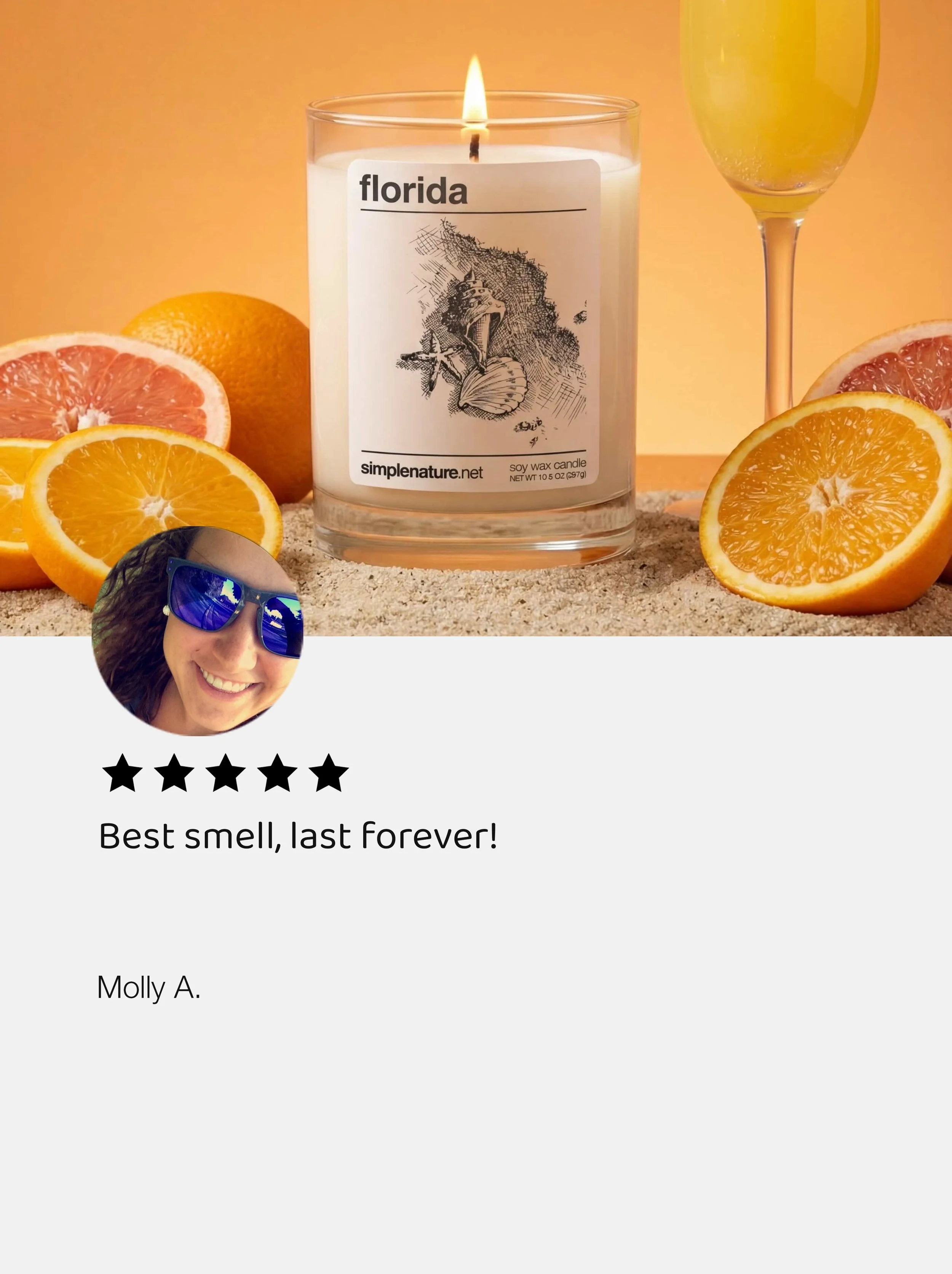A beach scene with a lit candle in a glass container labeled 'Florida,' surrounded by slices of orange and grapefruit, with a glass of yellow beverage and an orange fruit in the background.