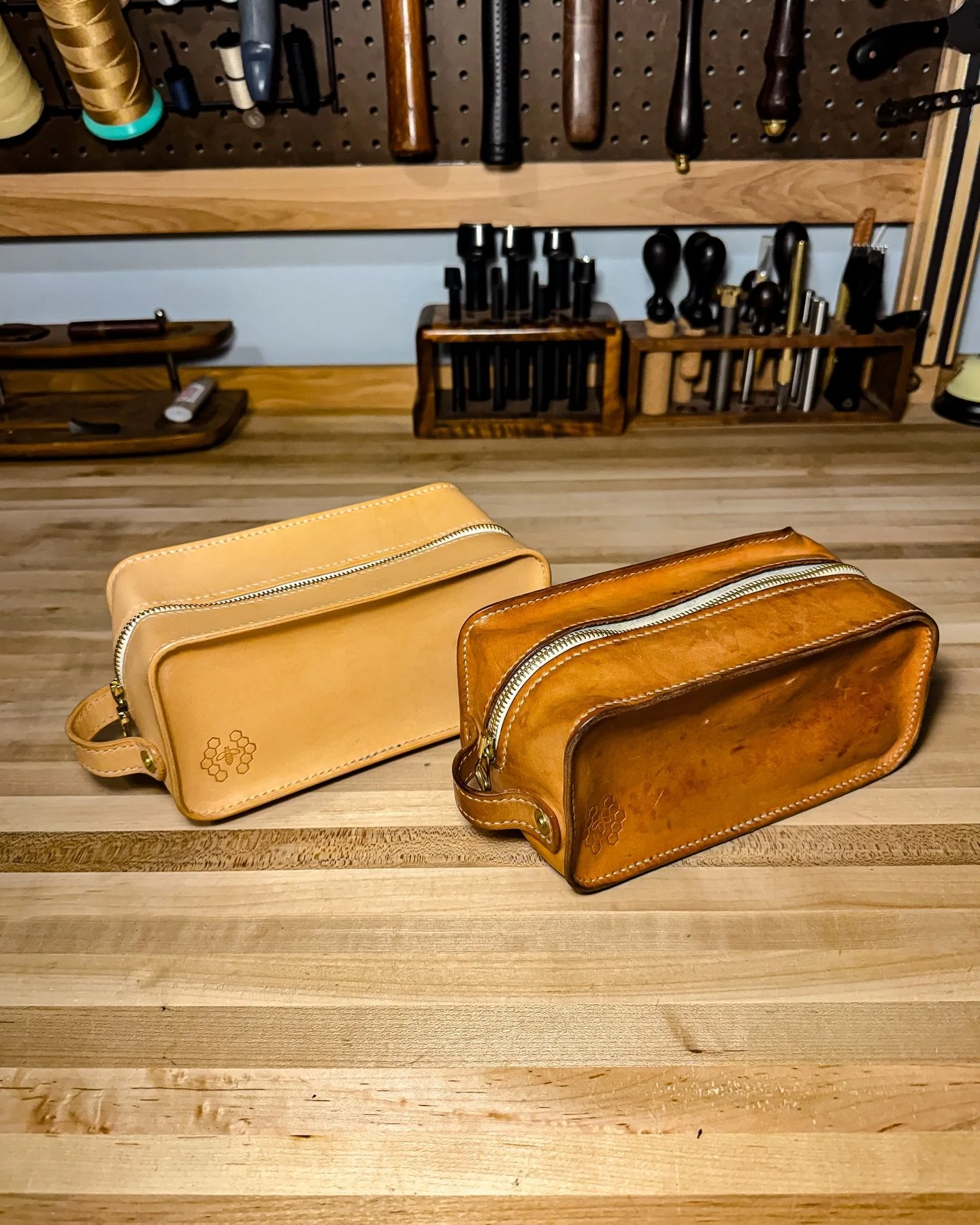 ||DOPP KIT||
&bull;
Watching leather age is a beautiful thing.
These two bags started out identical&mdash;same natural veg-tan hide, same pattern, same build. One is fresh off the bench; the other weathered through everyday use, shaped by time, wear,