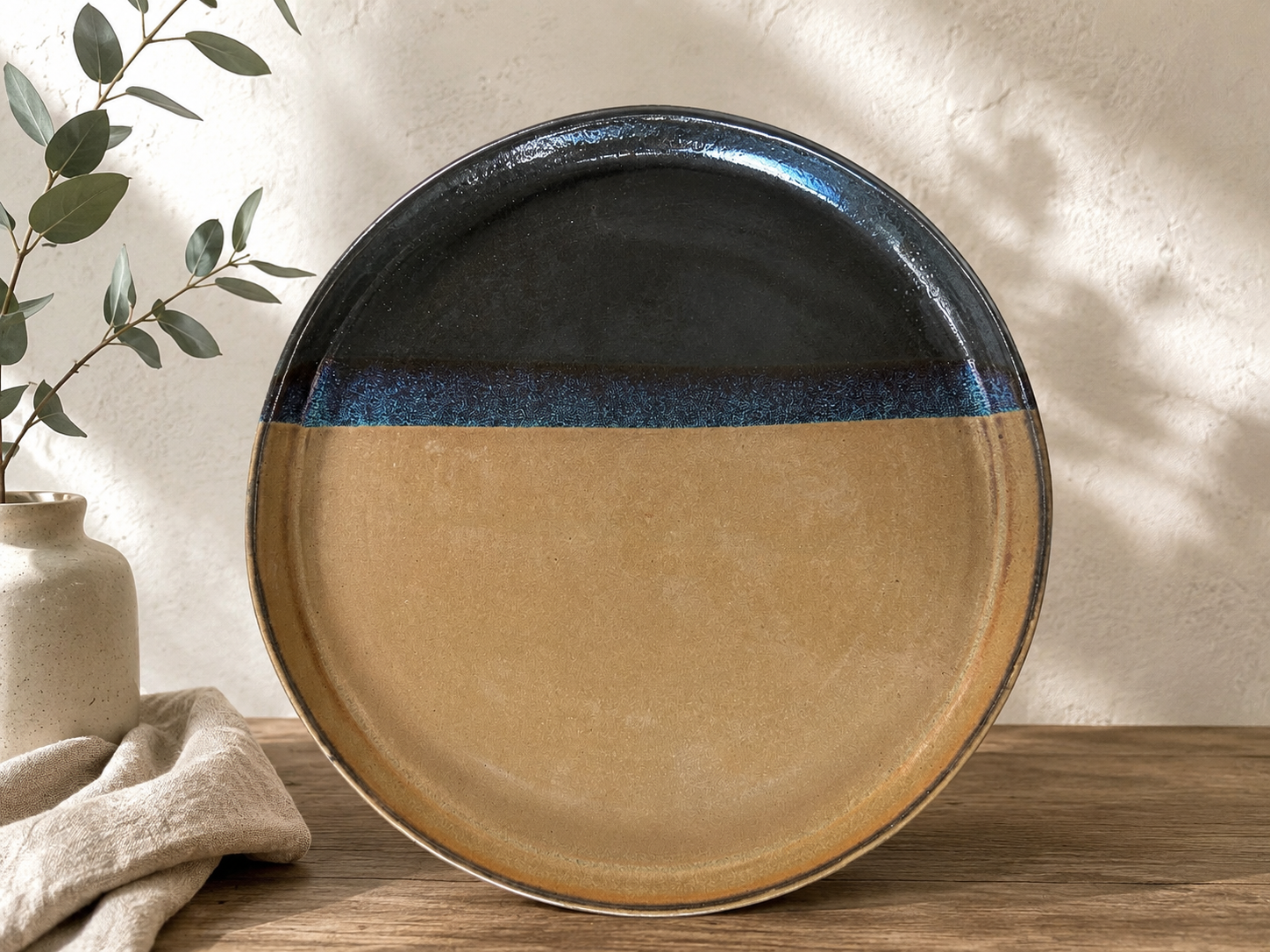 Myriame Sarah Weiner | Handmade Duo Tone Plates | These handcrafted plates are hand built from rich black stoneware clay.