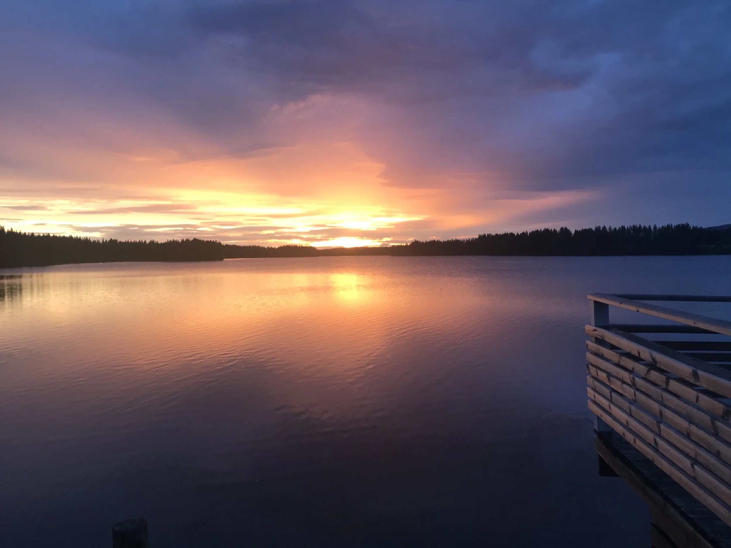 Midnight sun going down at a lake in Lapland