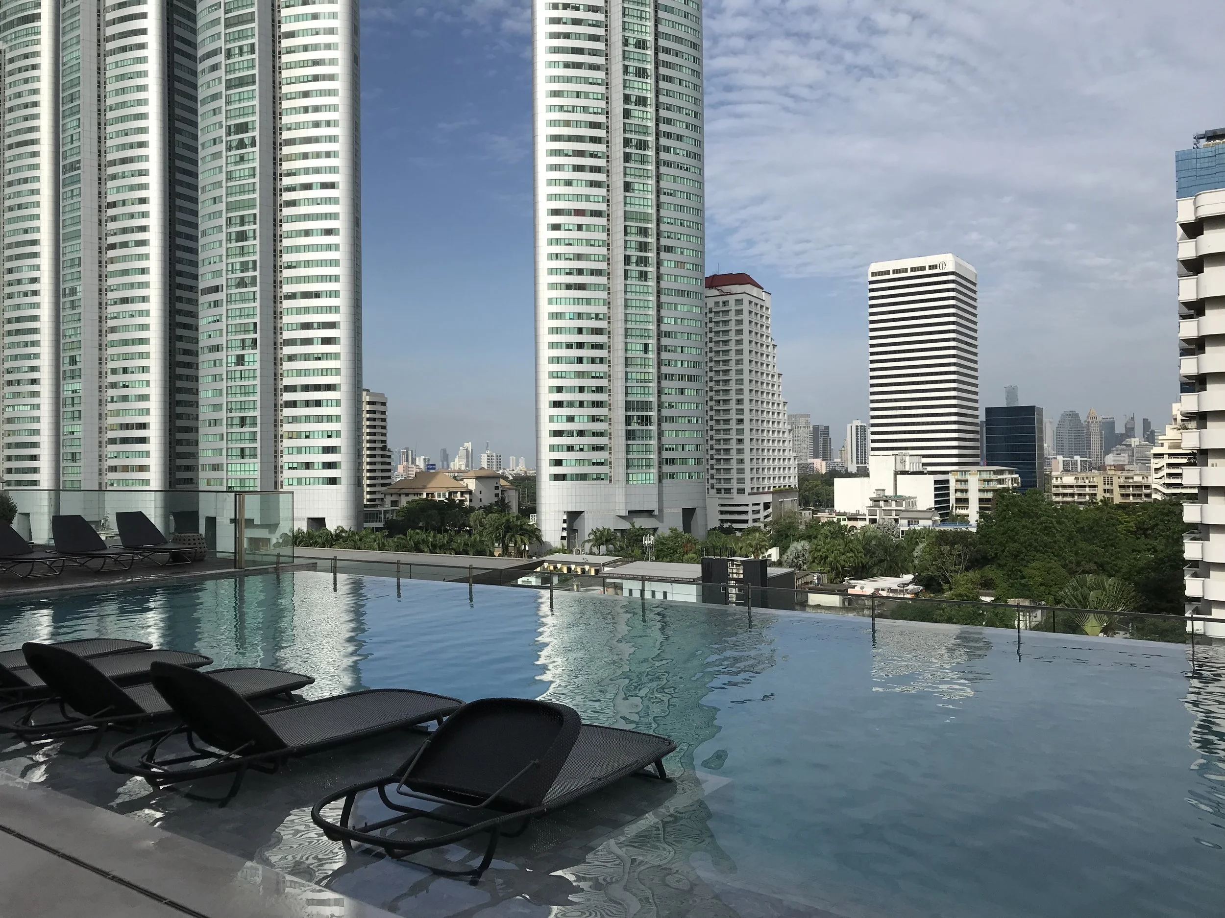Infinity pool with skyline view of Bangkok