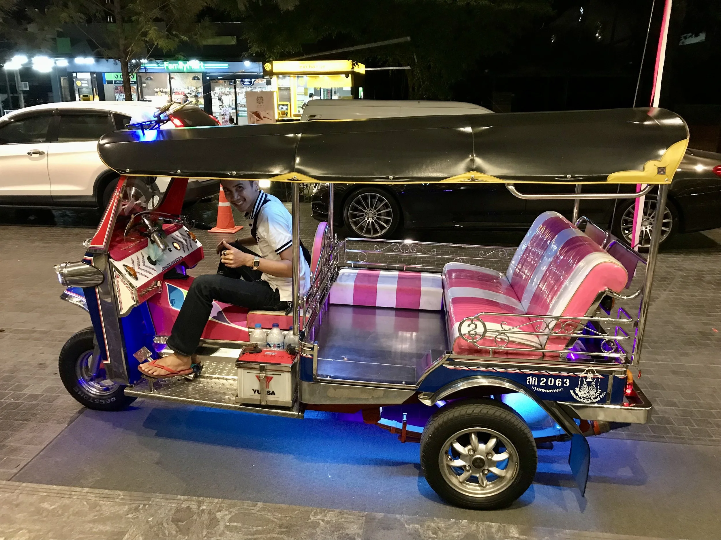 Smiling man in a TukTuk