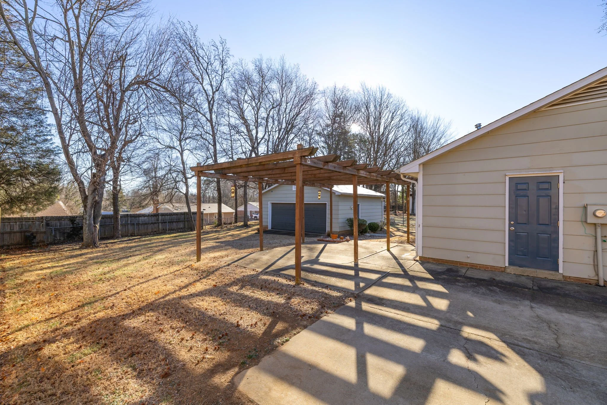 Rear exterior view of the home with private backyard space