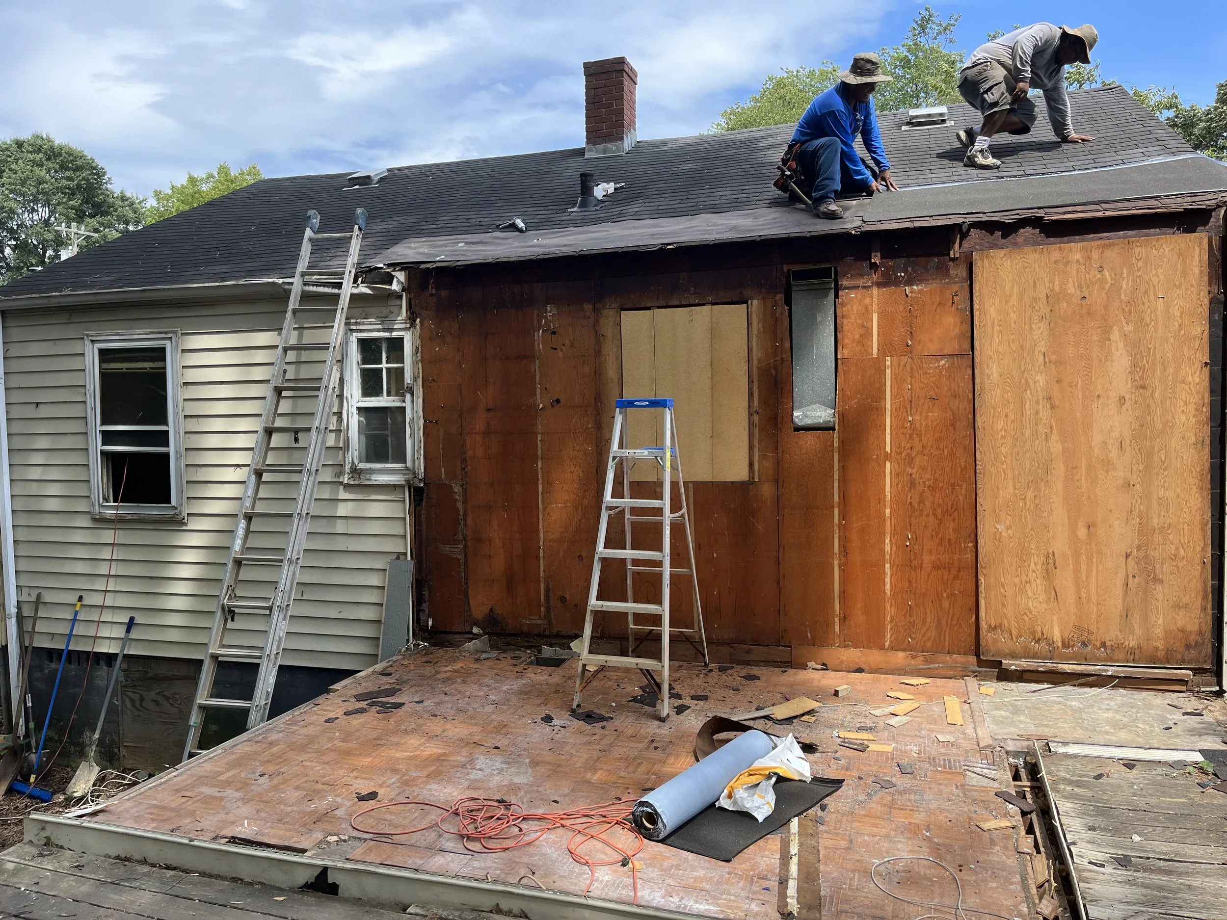  After the addition was taken off we had to cover up the huge open back of the house so repairs could be made and a new exterior wall could be built so Jose added temporary wood. He was working from early in the morning until late at night to get thi