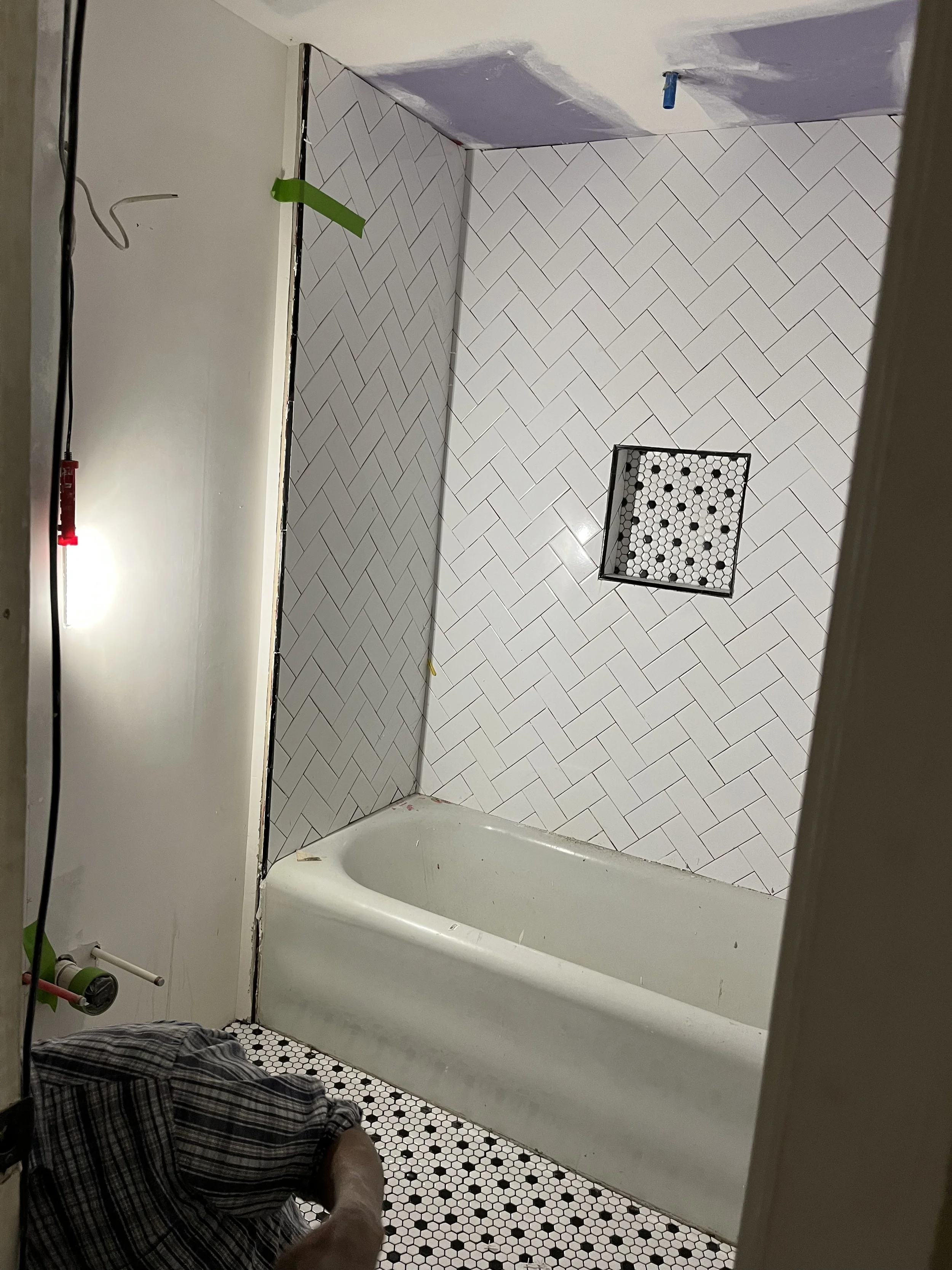  We are making some progress on the tile for the bathroom and I am getting really excited about how this looks. This salvaged tub will make it feel like this is just how the house was originally. There will be three different shower heads in this sho
