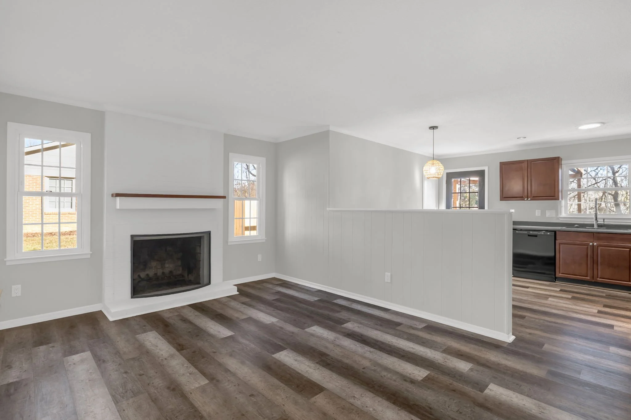 Den or dining room with fireplace at 5218 Lawndale Dr in Greensboro NC featuring a cozy gathering space and flexible layout