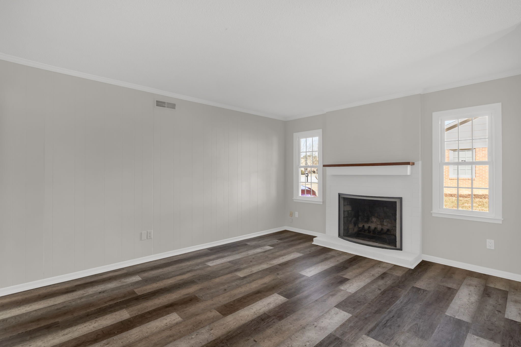 Comfortable den or dining space with fireplace offering a second living or dining space at 5218 Lawndale Dr in Greensboro NC