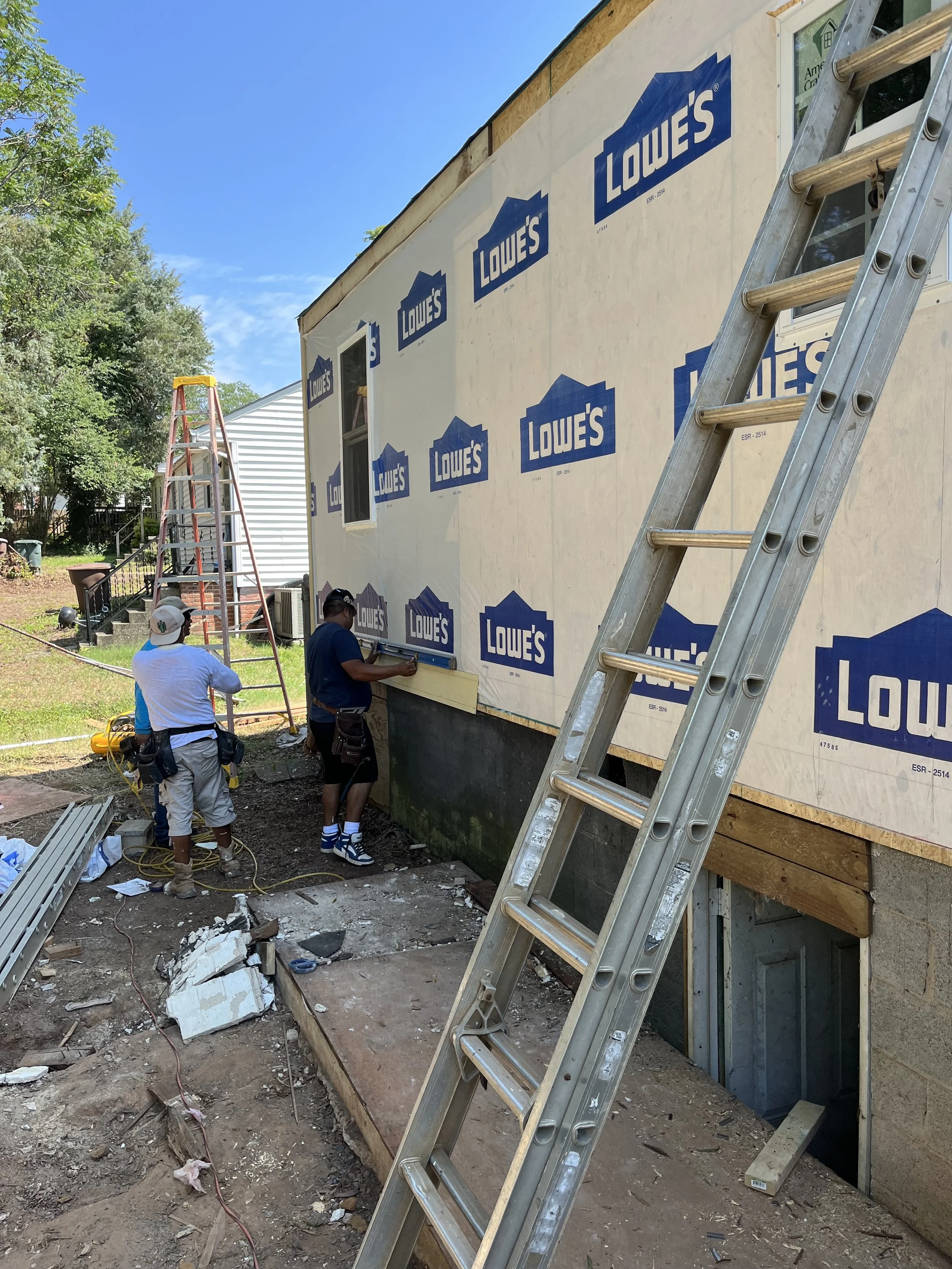  Finally, some house wrap after the new back wall was framed in. The sill plate and band had to be replaced as well as all framing, insulation, and siding. We took out the bathroom window and added back a window in the kitchen.  