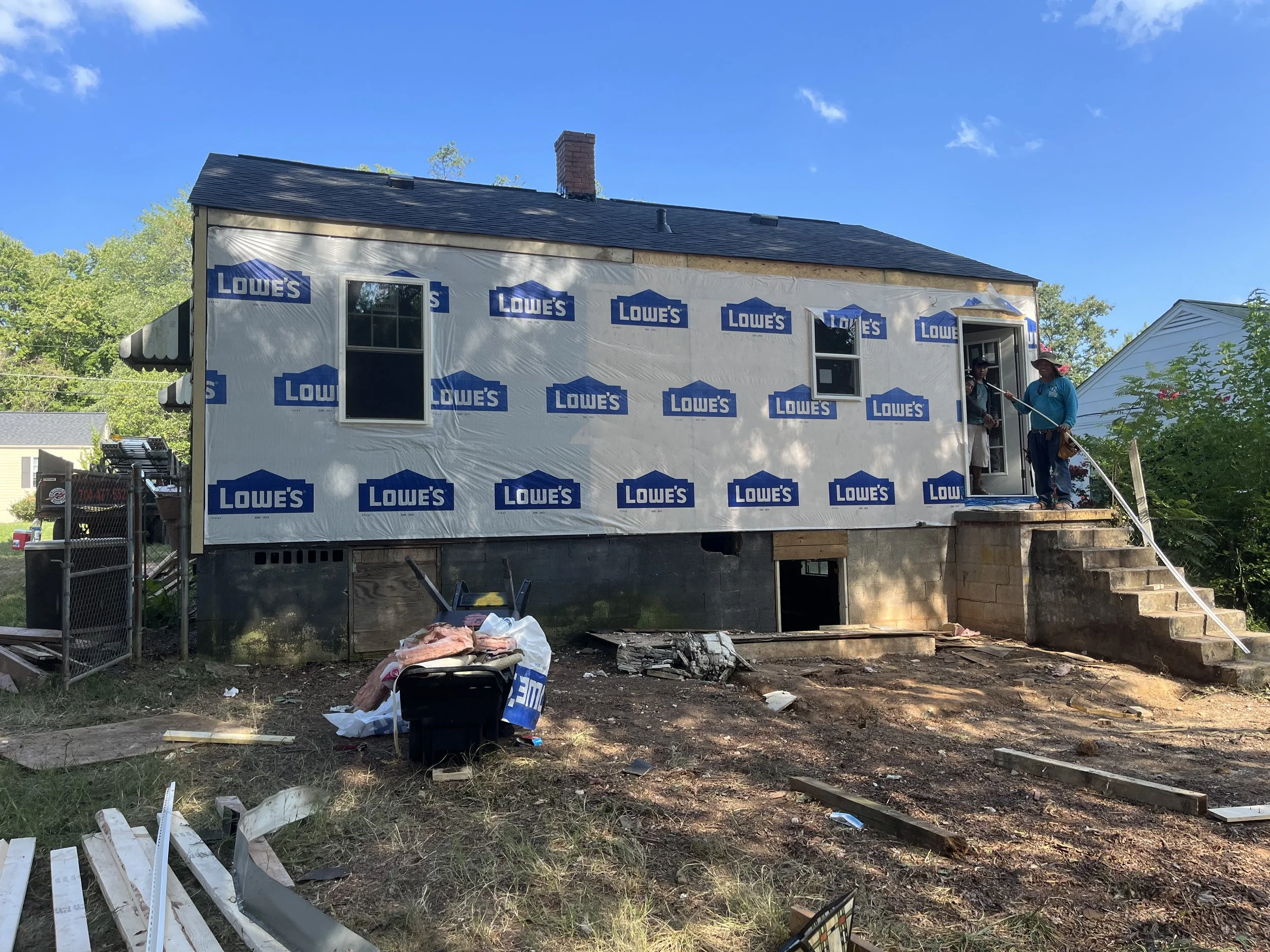  Finally, some house wrap after the new back wall was framed in. The sill plate and band had to be replaced as well as all framing, insulation, and siding. We took out the bathroom window and added back a window in the kitchen.  