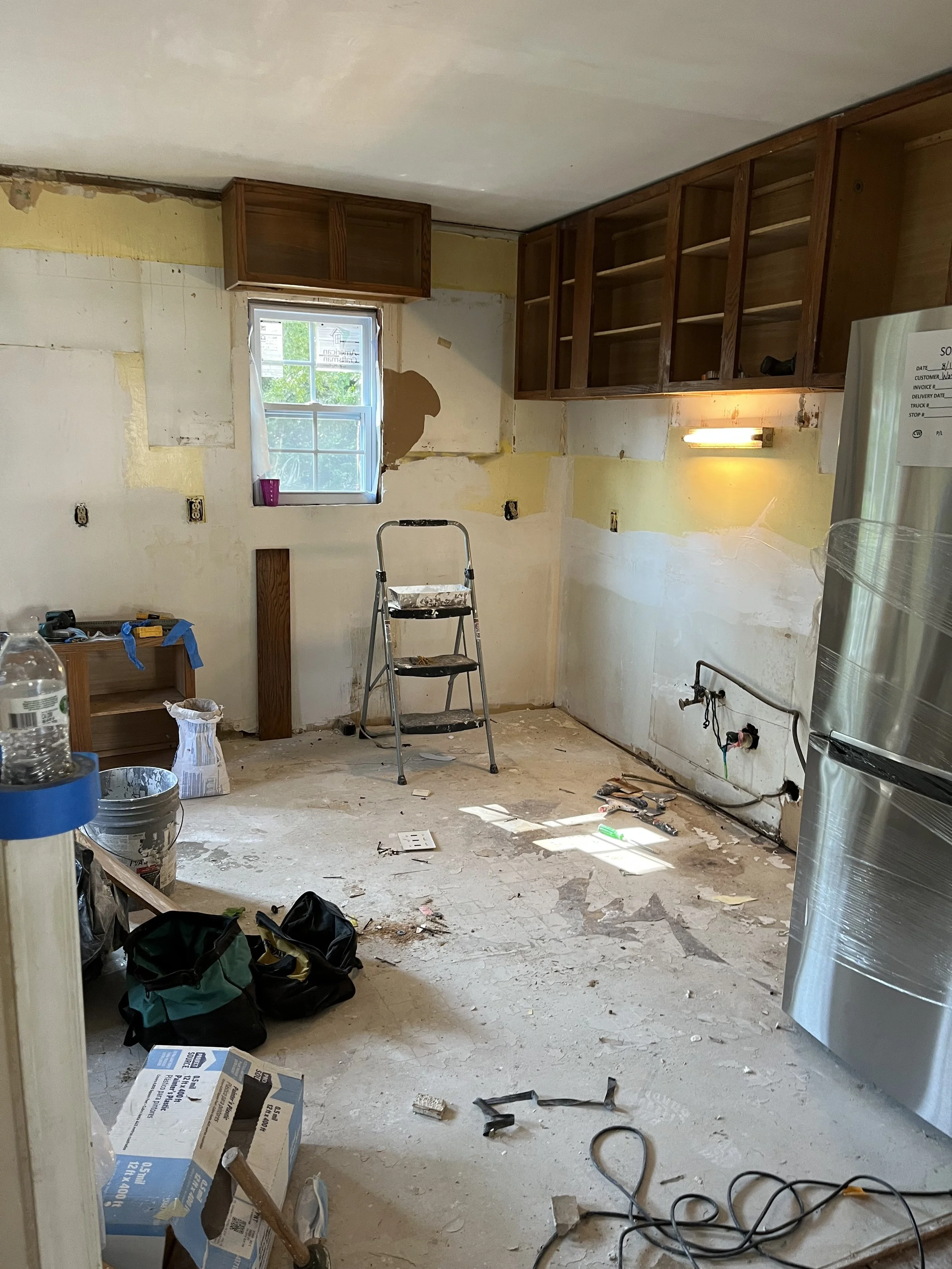 this home was being lived in prior to our ownership. The residents had not had any water in over a year. This photo was taken after we had removed the rotting addition from the back of the house and removed all of the contents