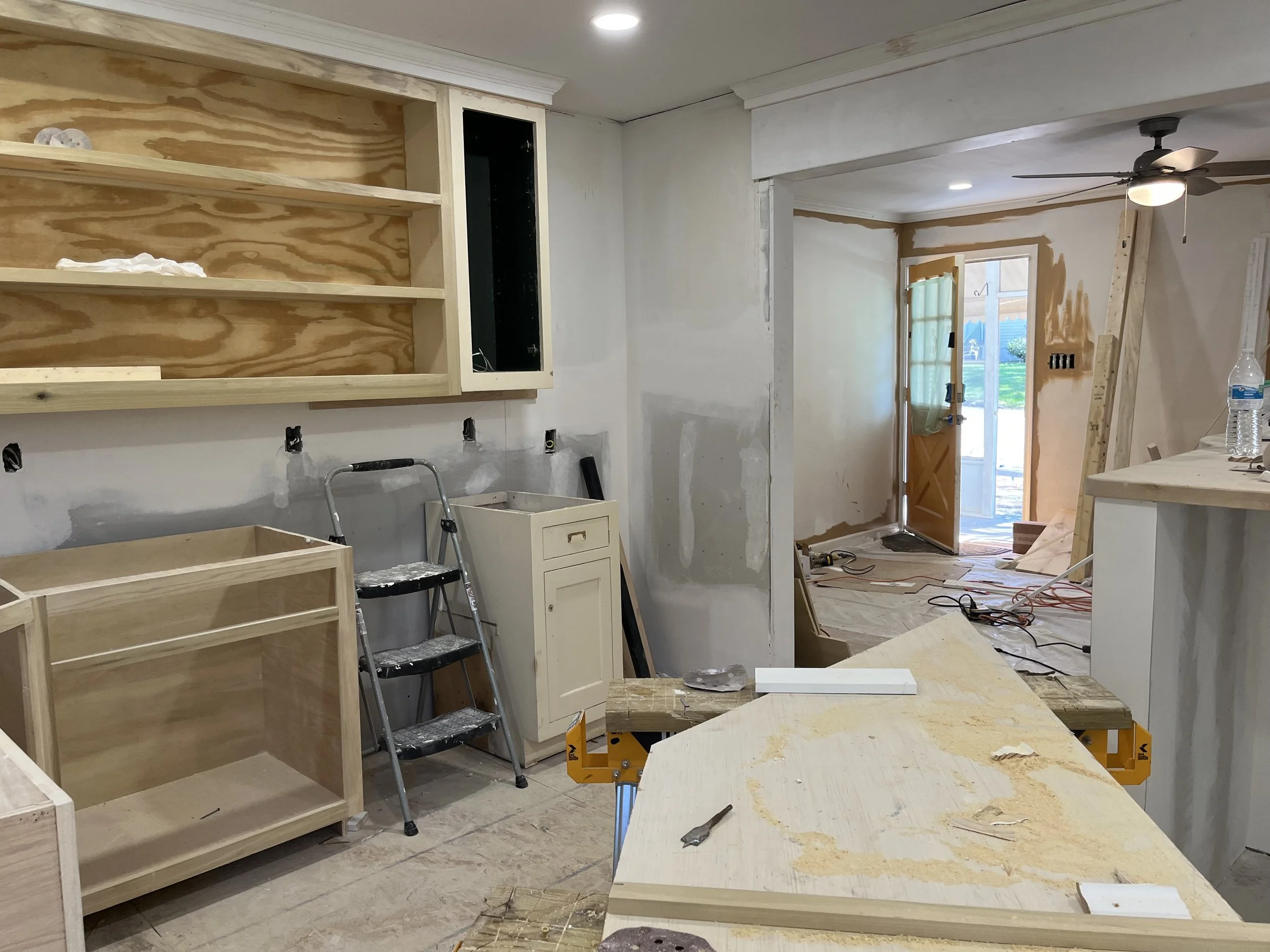  This is the kitchen cabinets at 1007 Grayland getting close to finished. Our carpenter has built cabinets to match the ones I salvaged from Architectural Salvage and is giving them a coat of cabinet paint inside and out. Then a clear coat of paint w