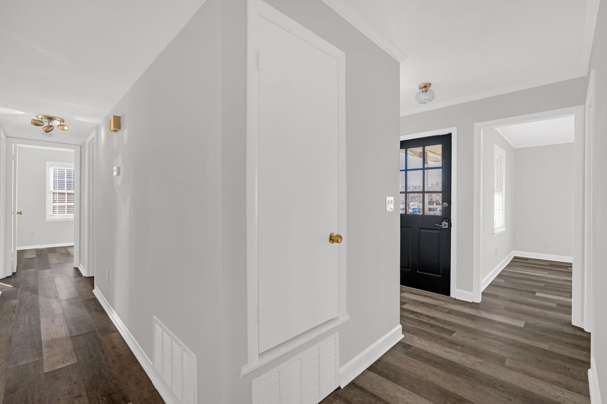 Open sightlines from front entry into living space and down hallway creating an easy flow throughout the home
