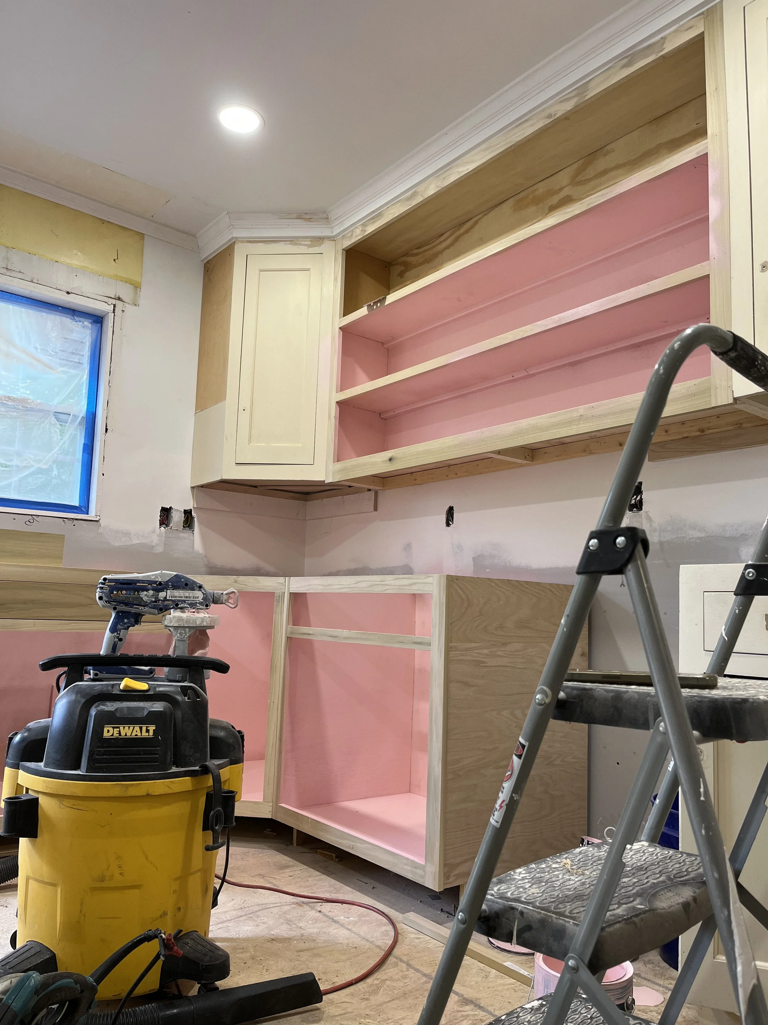 This is the kitchen cabinets at 1007 Grayland getting close to finished. Our carpenter has built cabinets to match the ones I salvaged from Architectural Salvage and is giving them a coat of cabinet paint inside and out. Then a clear coat of paint w
