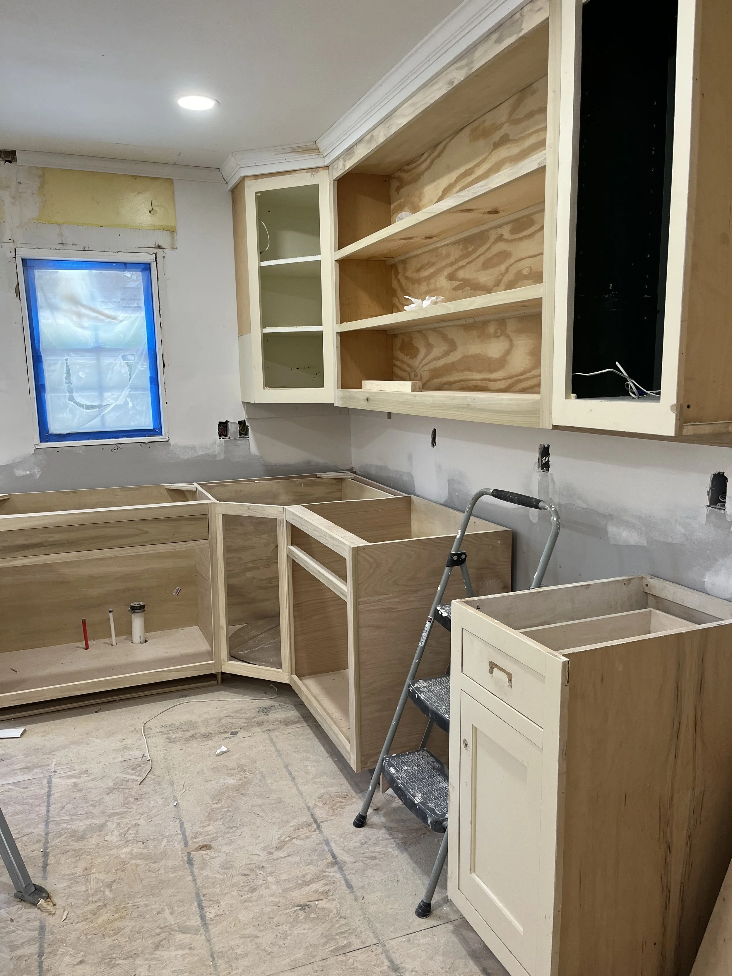  This is the kitchen cabinets at 1007 Grayland getting close to finished. Our carpenter has built cabinets to match the ones I salvaged from Architectural Salvage and is giving them a coat of cabinet paint inside and out. Then a clear coat of paint w