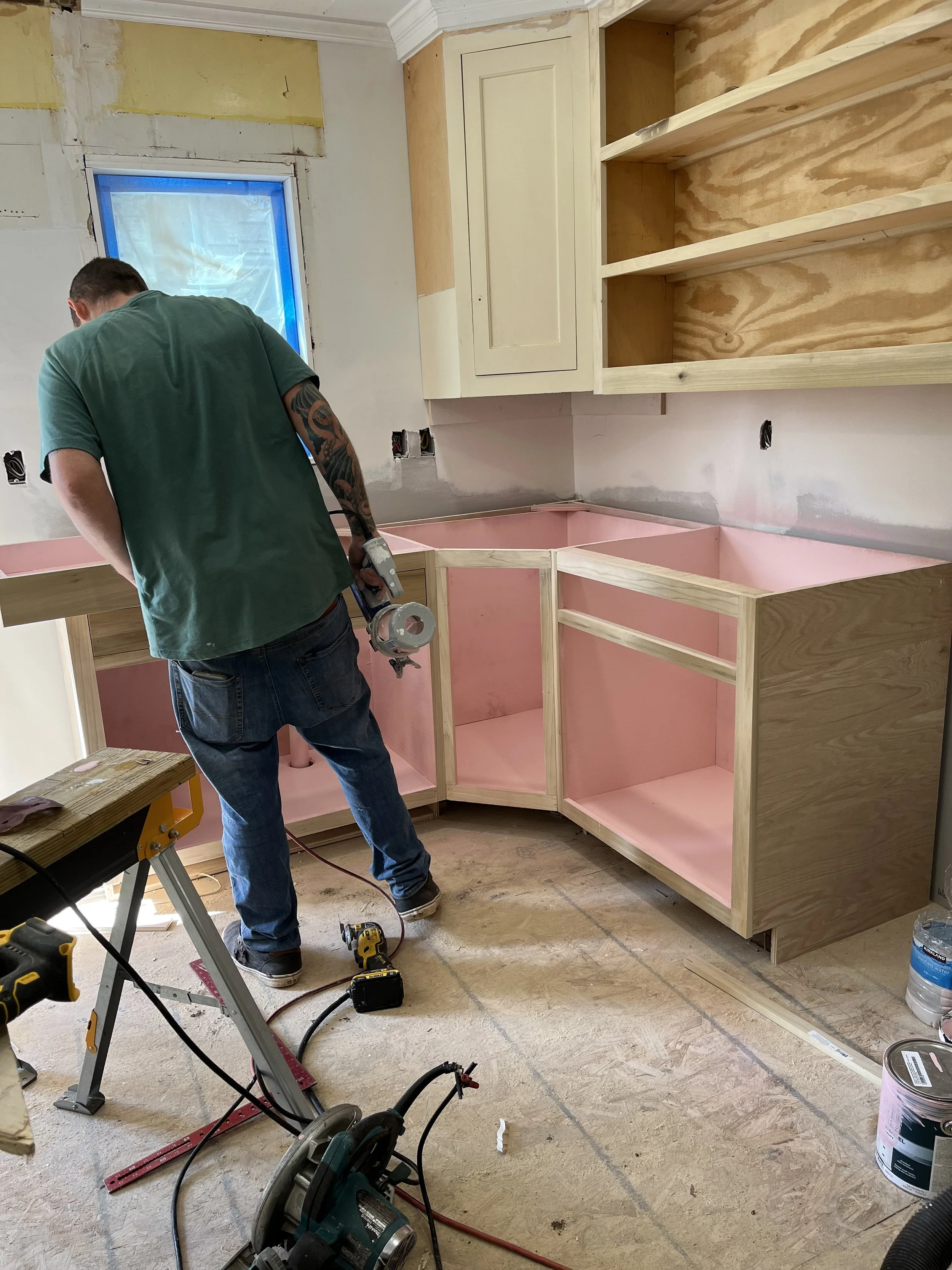  This is the kitchen cabinets at 1007 Grayland getting close to finished. Our carpenter has built cabinets to match the ones I salvaged from Architectural Salvage and is giving them a coat of cabinet paint inside and out. Then a clear coat of paint w