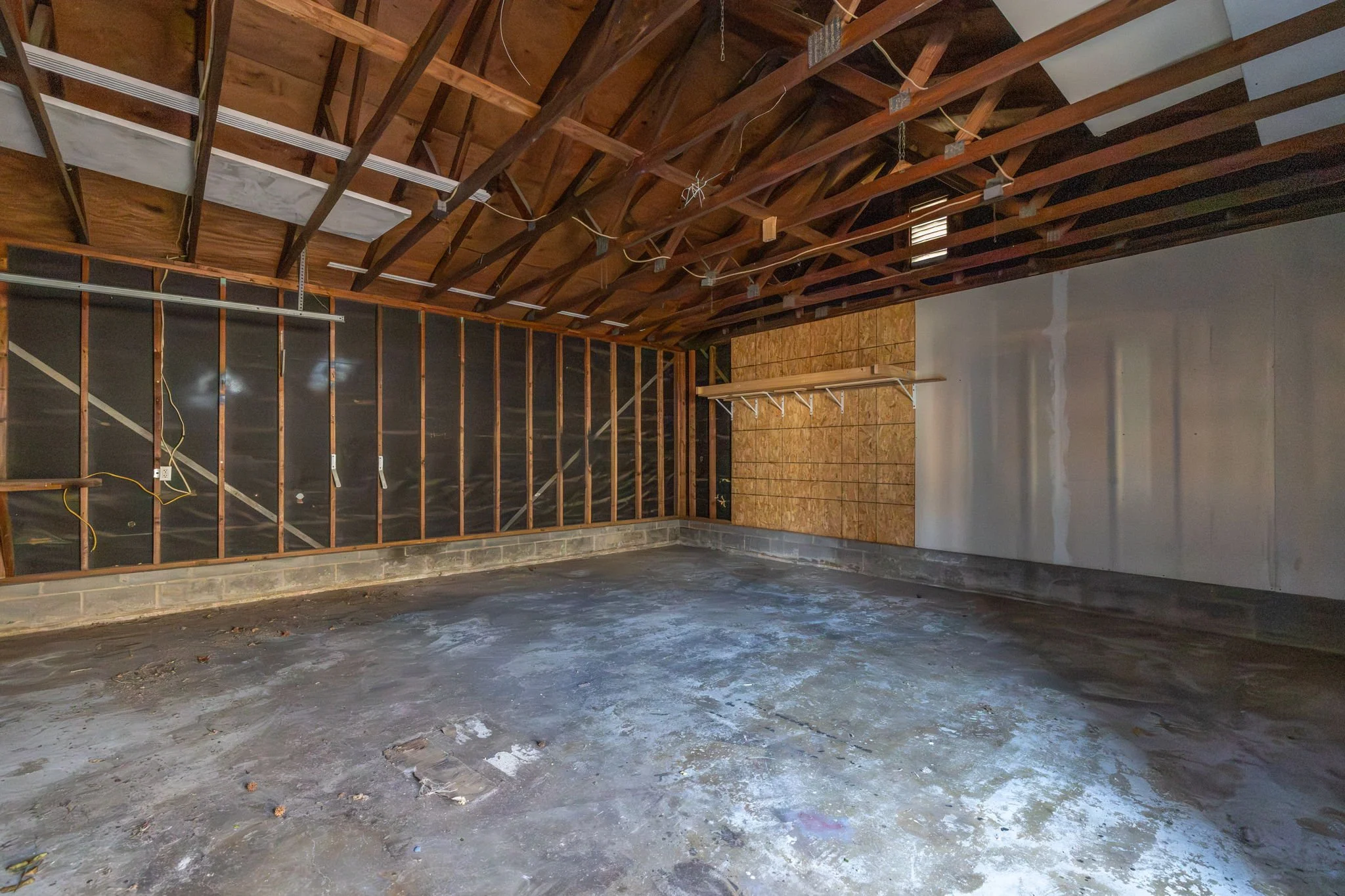 Interior of two car garage offering workspace or additional storage options