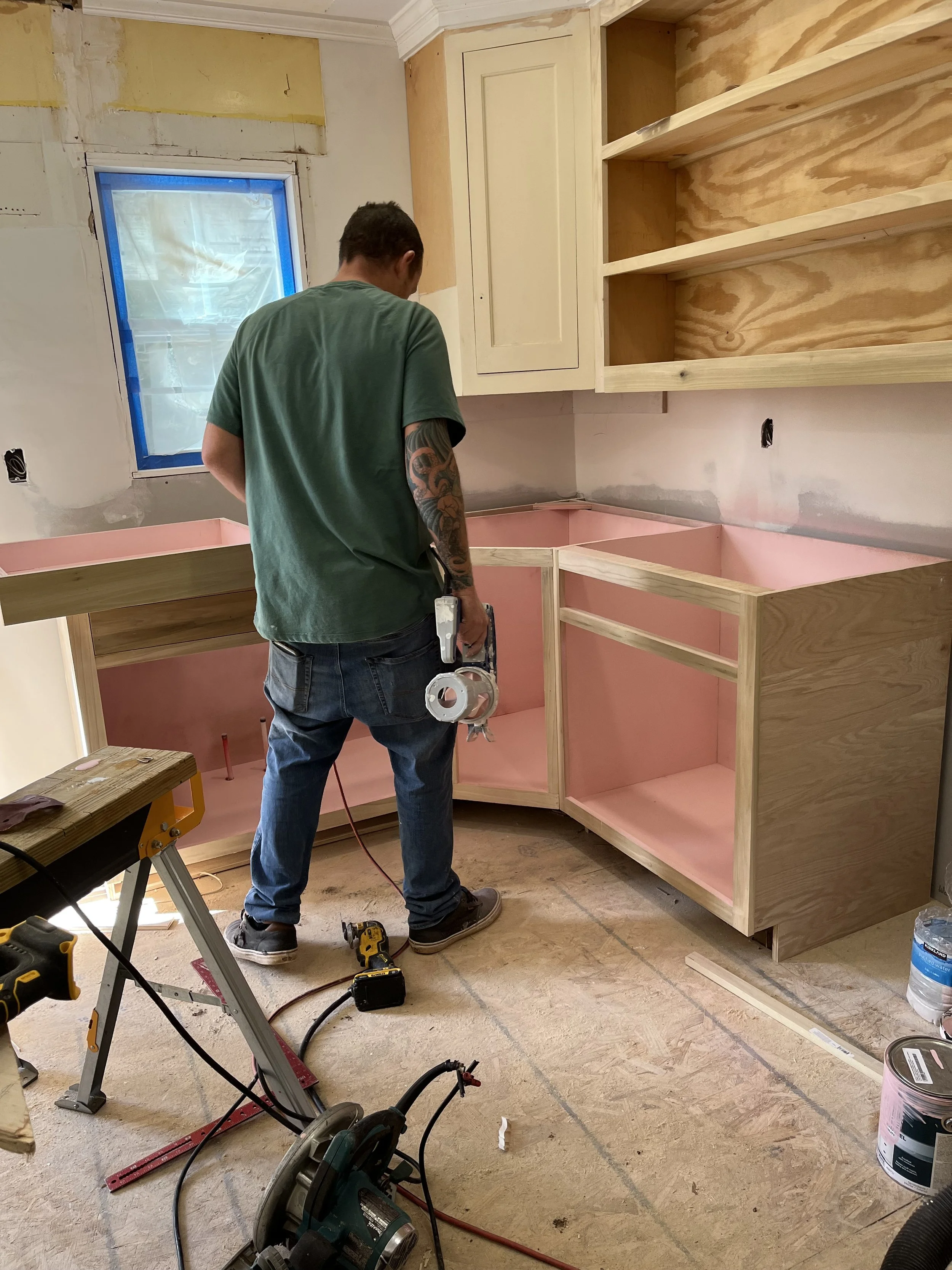  This is the kitchen cabinets at 1007 Grayland getting close to finished. Our carpenter has built cabinets to match the ones I salvaged from Architectural Salvage and is giving them a coat of cabinet paint inside and out. Then a clear coat of paint w