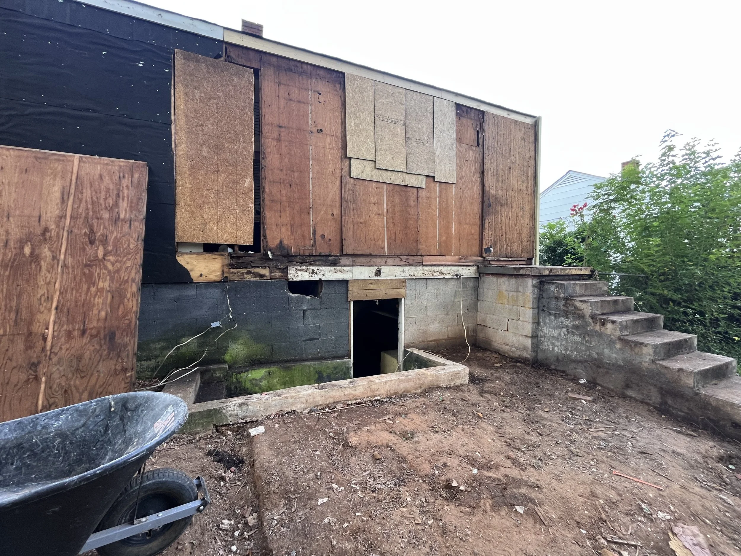 Temporary wood on back of house after demo 