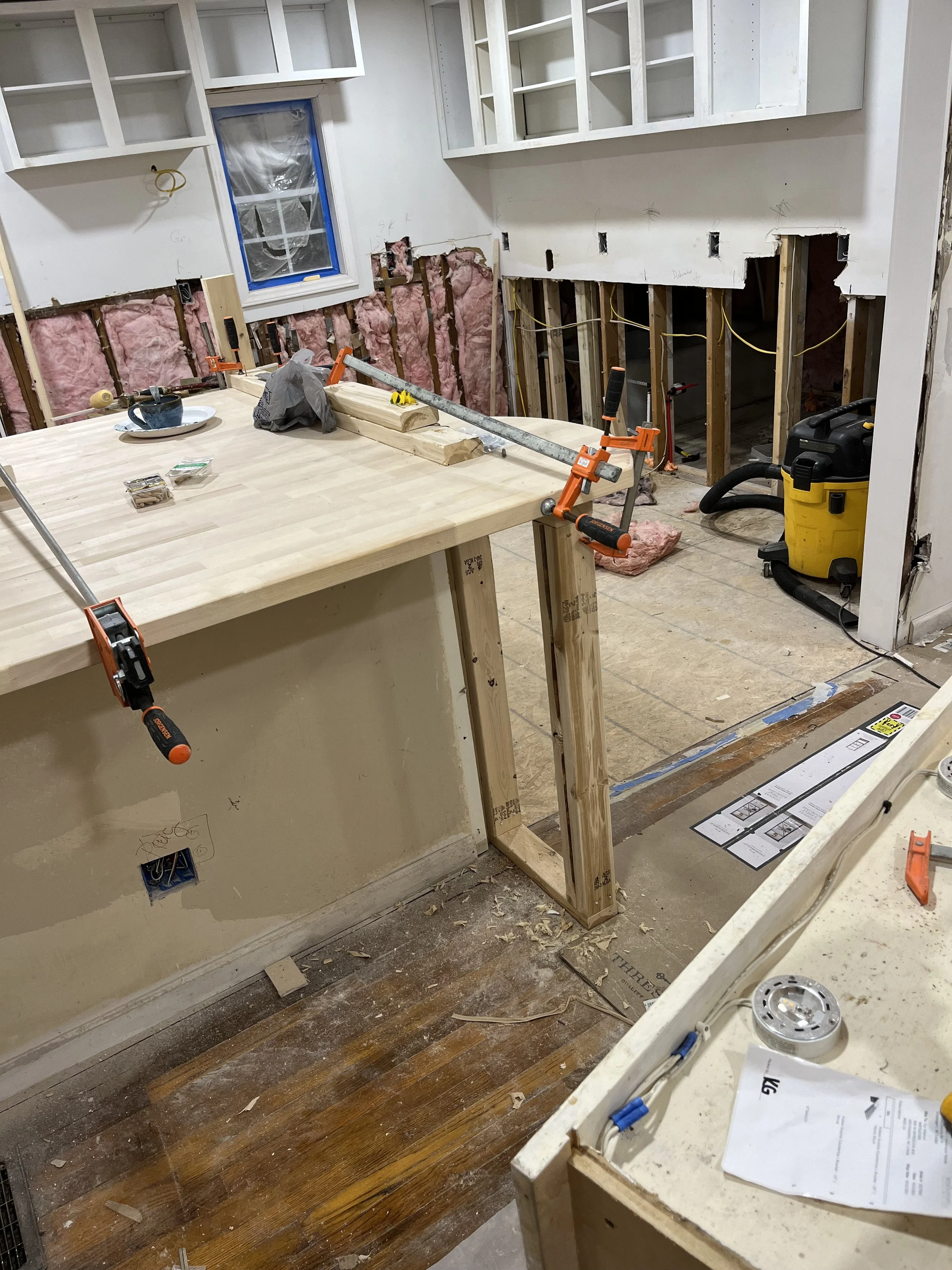  This is the livingroom side of the bar. We will place bar stools on the livingroom side. The other side of this opens to the kitchen. This other side is where the washer and dryer will be.  