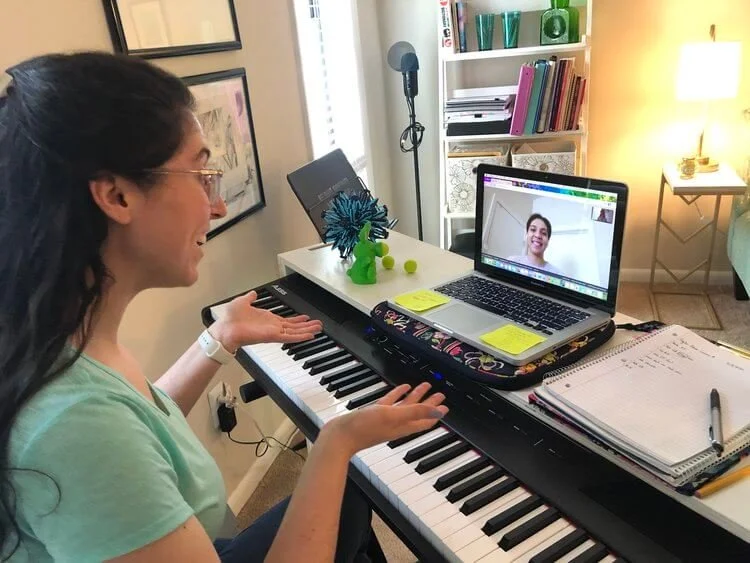 woman teaching online voice lesson