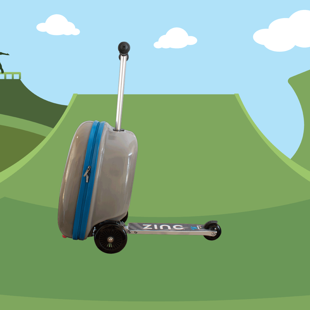 A silver and blue suitcase with a black handle on a green skateboarding ramp, with a sky background and some clouds.
