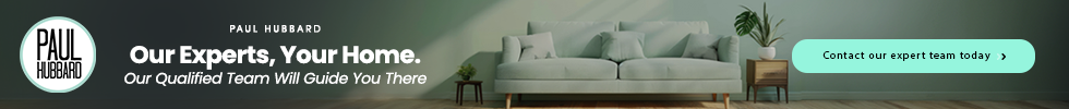 Banner ad for Paul Hubbard featuring a modern living room with a white sofa, green plants, and a call-to-action button to contact their expert team.