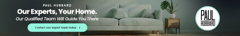 Banner with a green sofa, a wooden side table with a potted plant, and text promoting Paul Hubbard's expert home guidance.