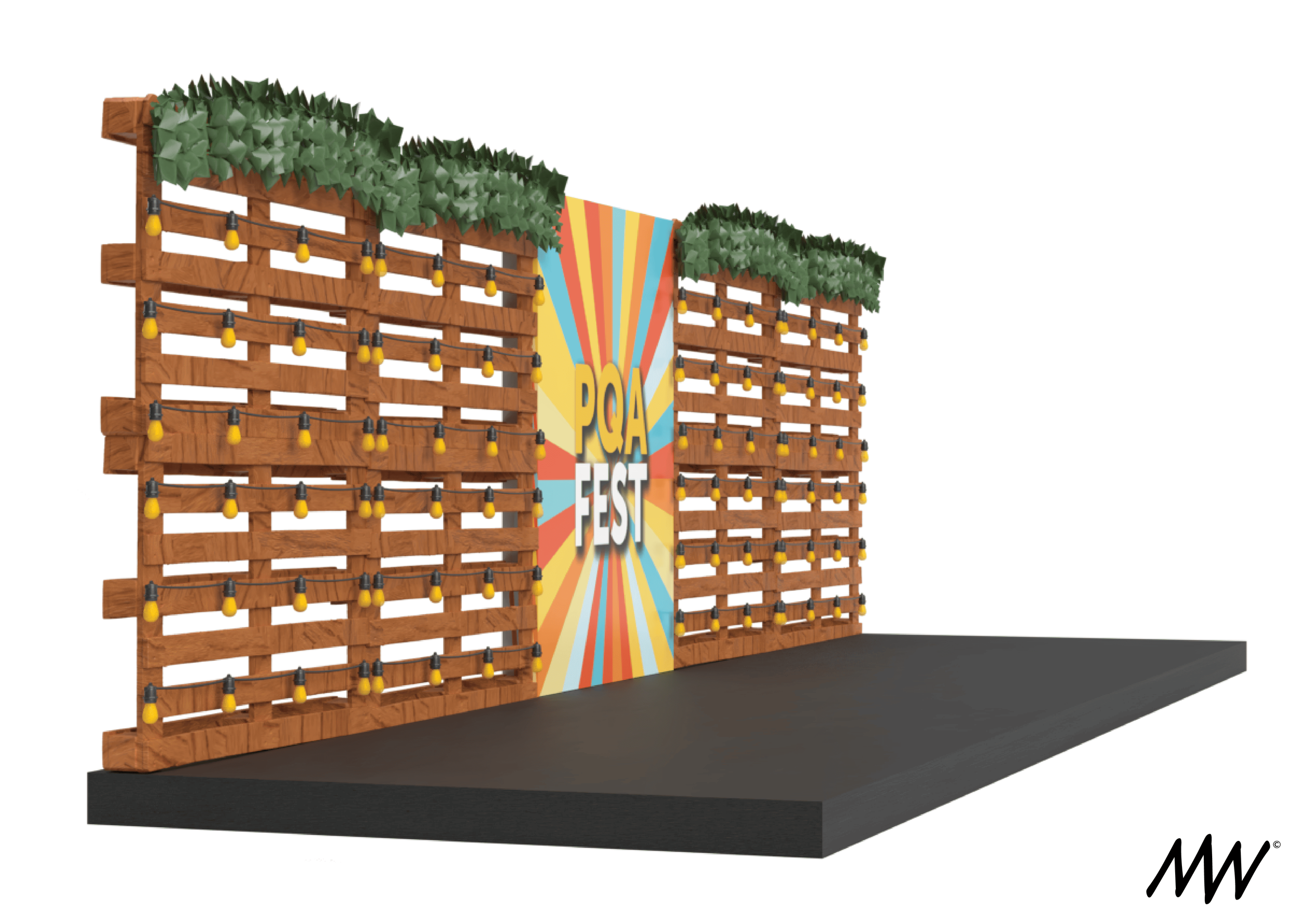 Stage setup with wooden pallet wall decorated with string lights on top, green foliage at the top, and a colorful banner in the center that reads "PQA FEST".
