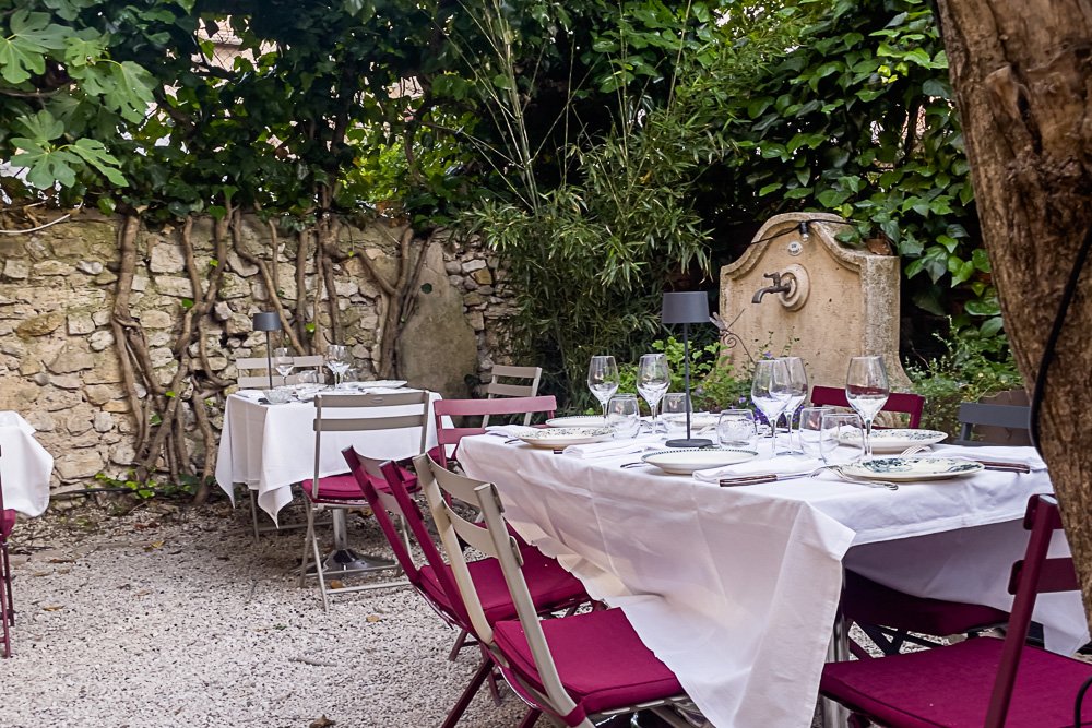white tablecloths pop against the natural courtyard