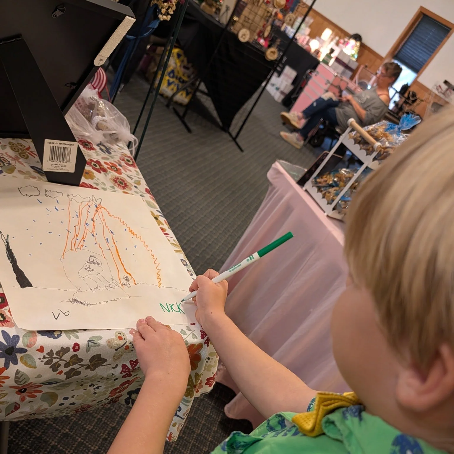 It was a SLOW day yesterday, and while I only sold 1 ornament, Nicky outsold the entire building. 

He now has an 'artist signature' and sold out of his first 6 paintings. So supplies were found and this little hustler made and sold more (at which po