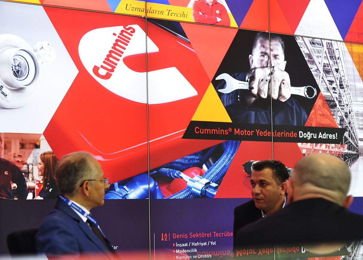 Close-up photo, company reps with visitors.