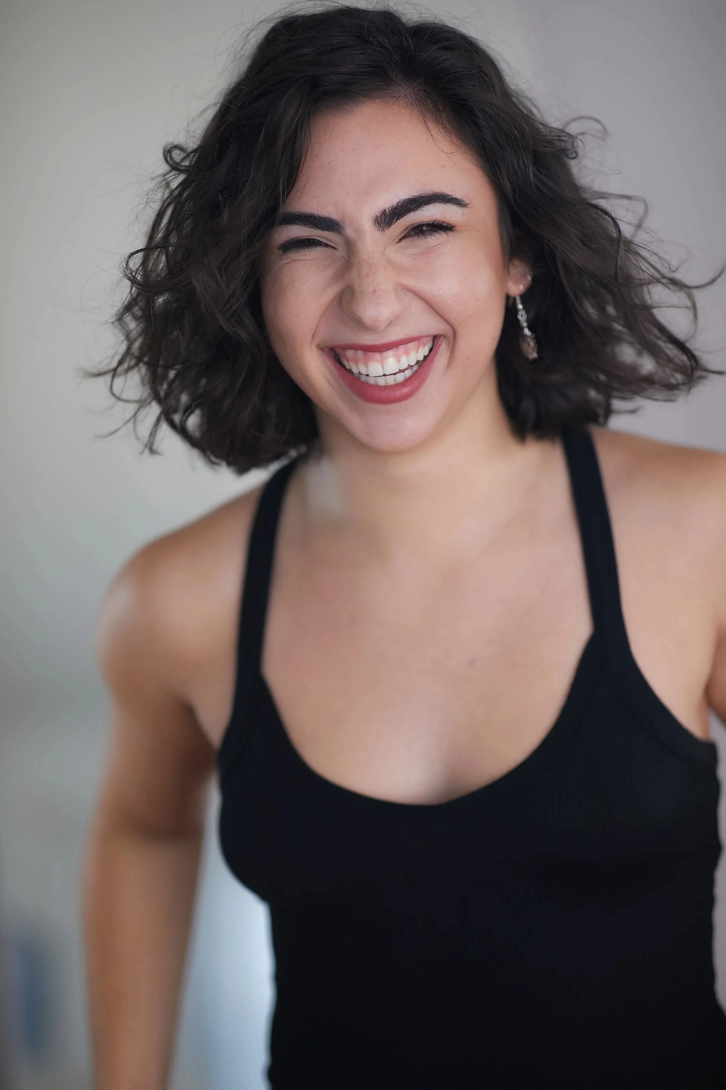 Sydney-Bossuk-Headshot-Laugh.jpg