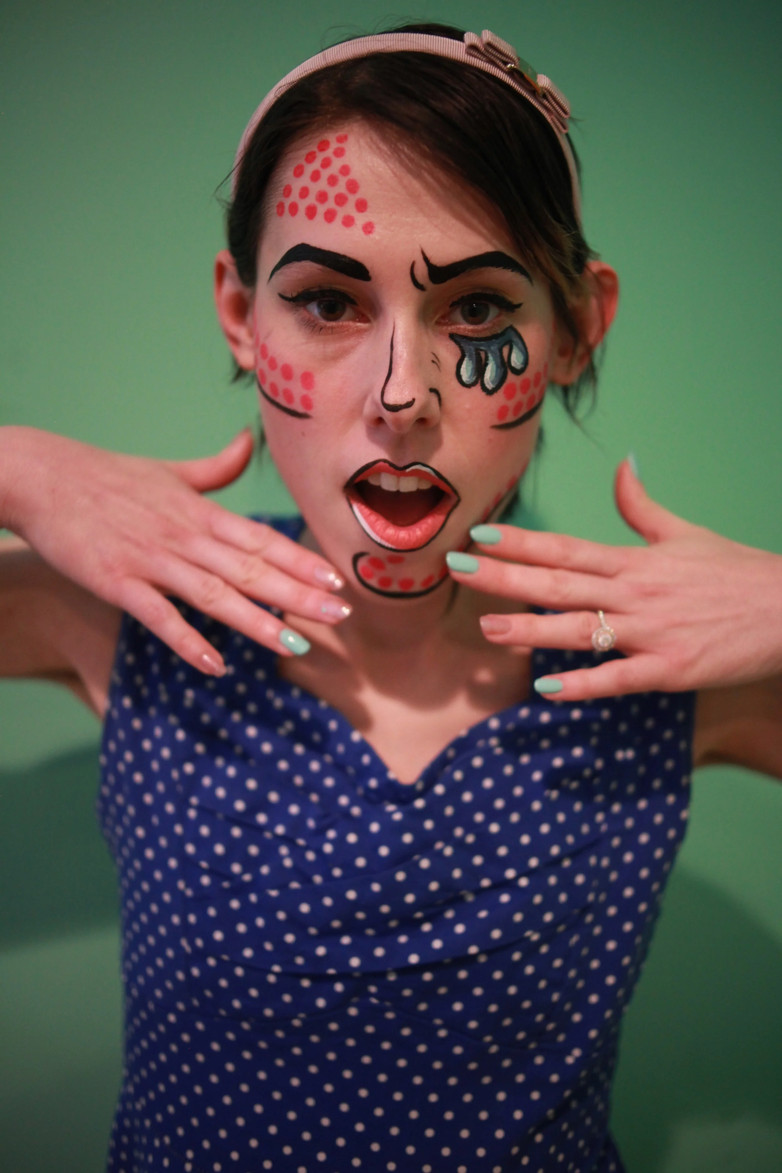 Image of a girl with comic book pop art style face paint done by artist Melissa Avalon of Dancing Canvas Art