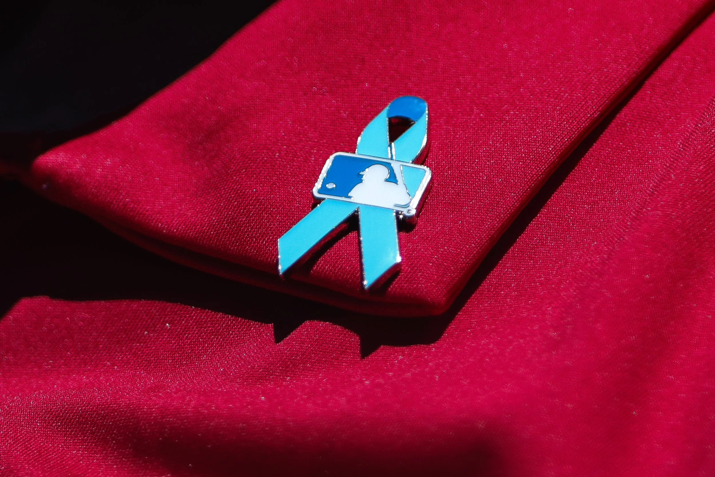 Jun 21, 2026; West Sacramento, California, USA; A deatiled view of the MLB Fathers Day pin worn by a member of the Los Angeles Angels before a baseball game against the Athletics at Sutter Health Park. Mandatory Credit: Scott Marshall-Imagn Image