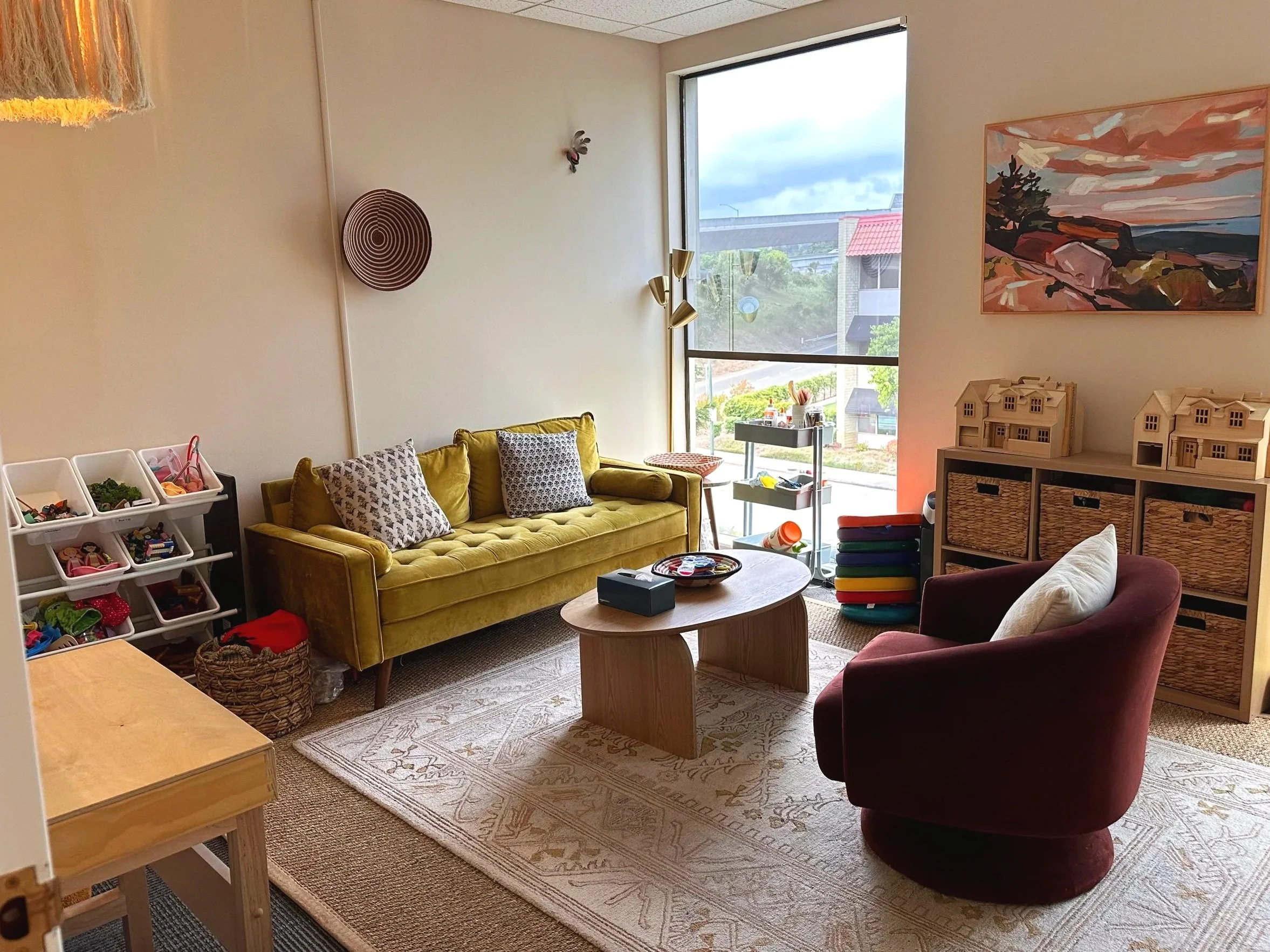 Tucked beside a window looking out to trees, this therapy corner is exactly that. A private, contained space filled with natural light. A good place to begin.