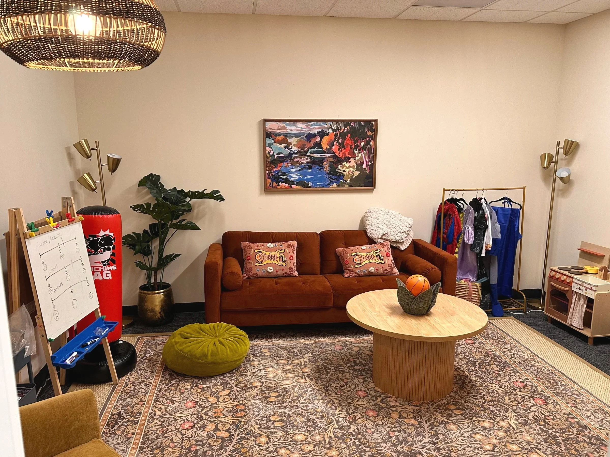 Some children need to wiggle, sprawl, and move before they can open up, and that is completely okay here. Our play therapy space is built for kids, not for sitting still.
