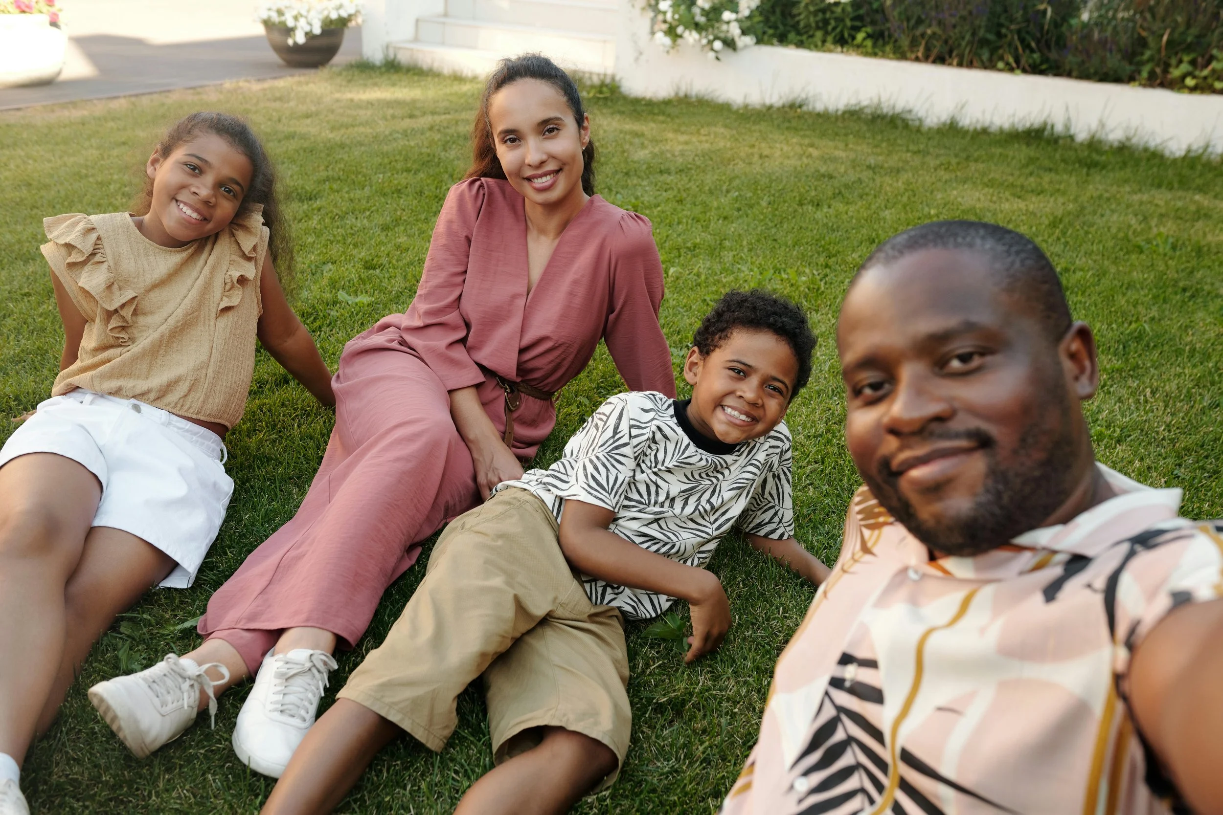A family sitting closely together outdoors, sharing a warm and connected moment that reflects parent therapy support in Walnut Creek.