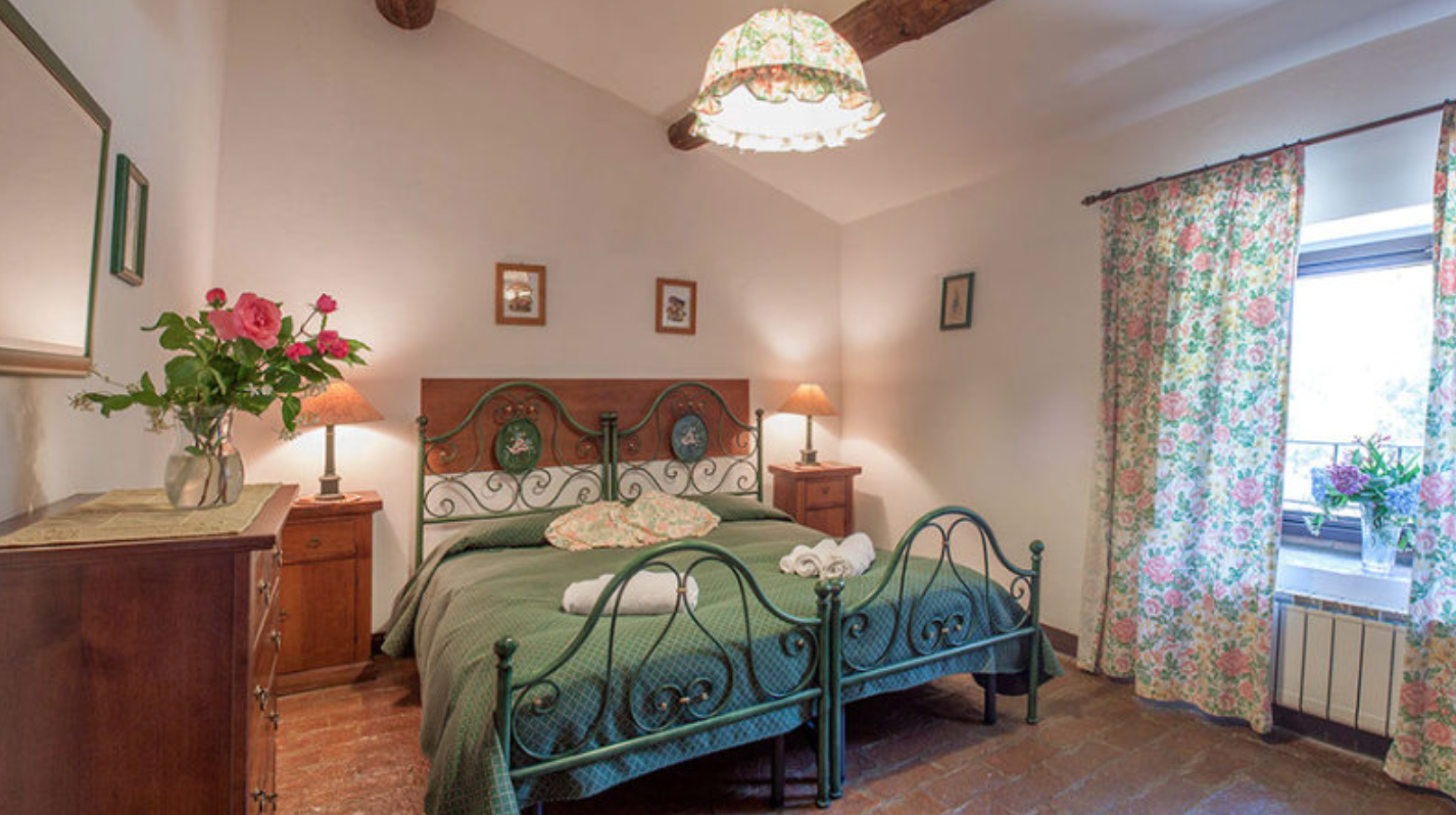 Charming bedroom in a restored farmhouse in Italy.