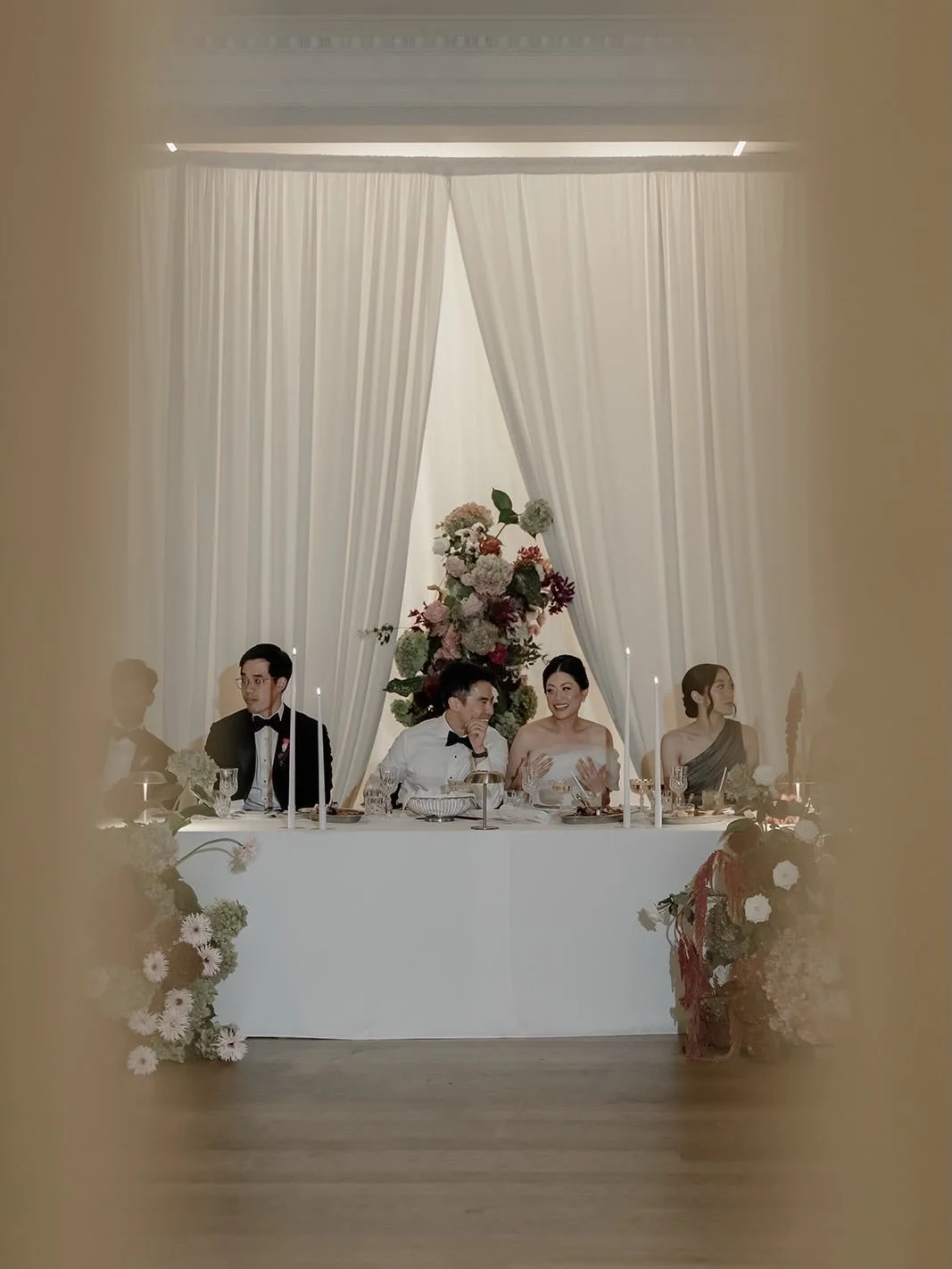 for euk kin &amp; liz &mdash;

chrome catching light.
mixed florals, loose.

chinese fans, reworked as menus &mdash;
heritage carried through.

a reveal through the drape,
just enough.

&mdash;

together with:

photography @kyrafols 
content creator 