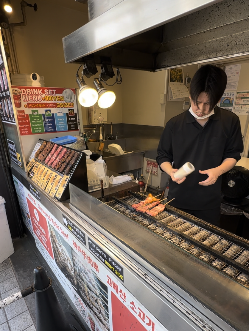 Street Food Vendor in Tokyo cooking meat