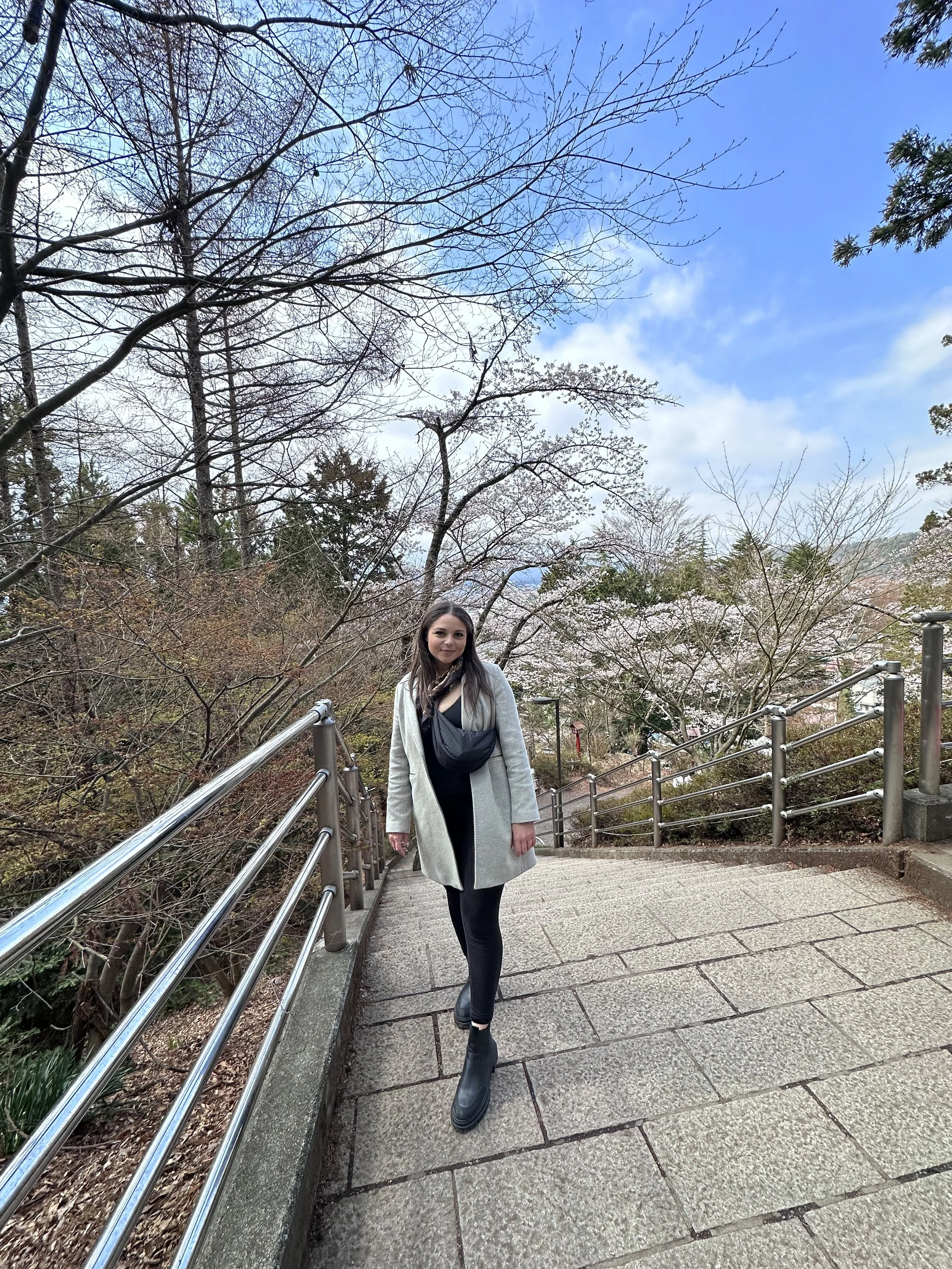 Shauny on the steps of Chureito Pagoda with cherry blossoms