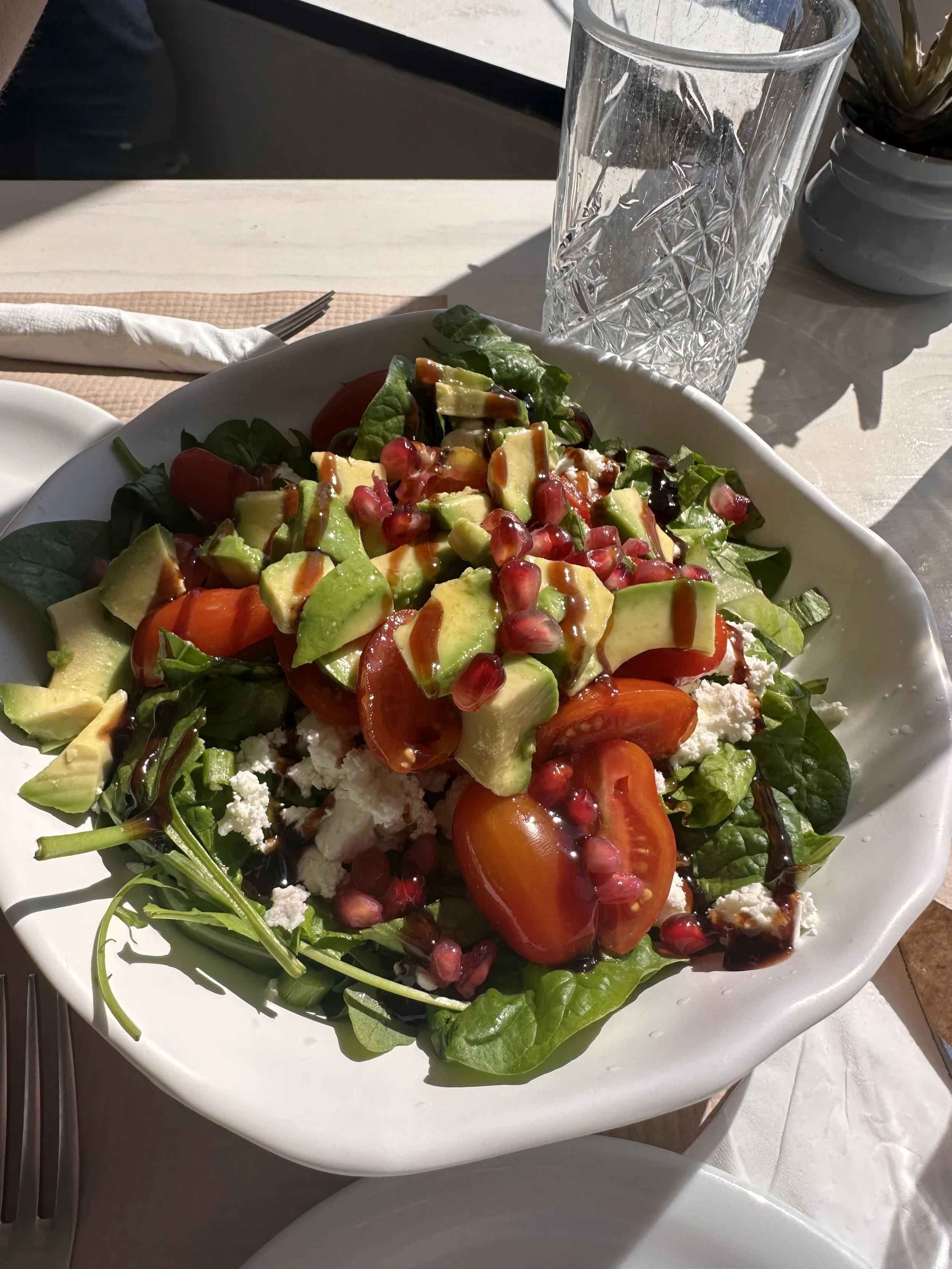 Greek Salad with tomatoes, spinach, feta and avocado