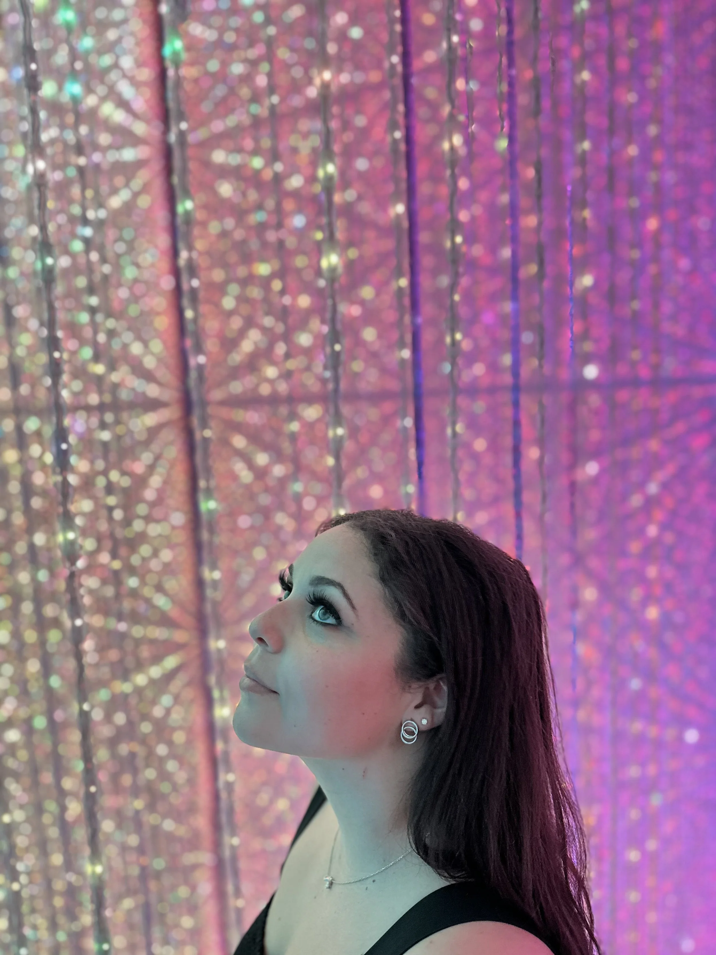 Shauny at teamLAB Planets, Tokyo lights in background