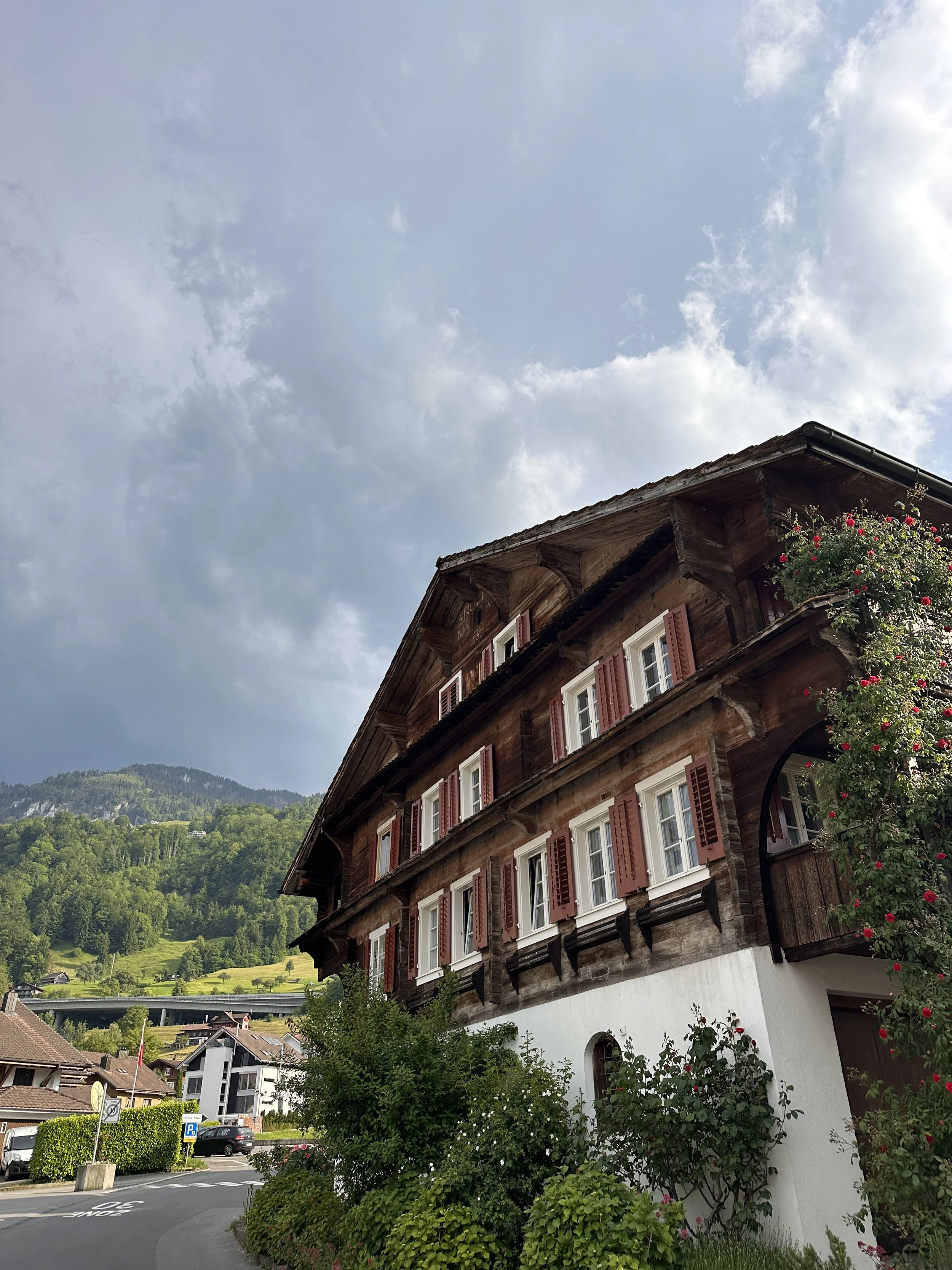 Brown Swiss Building with Cloudy Sky