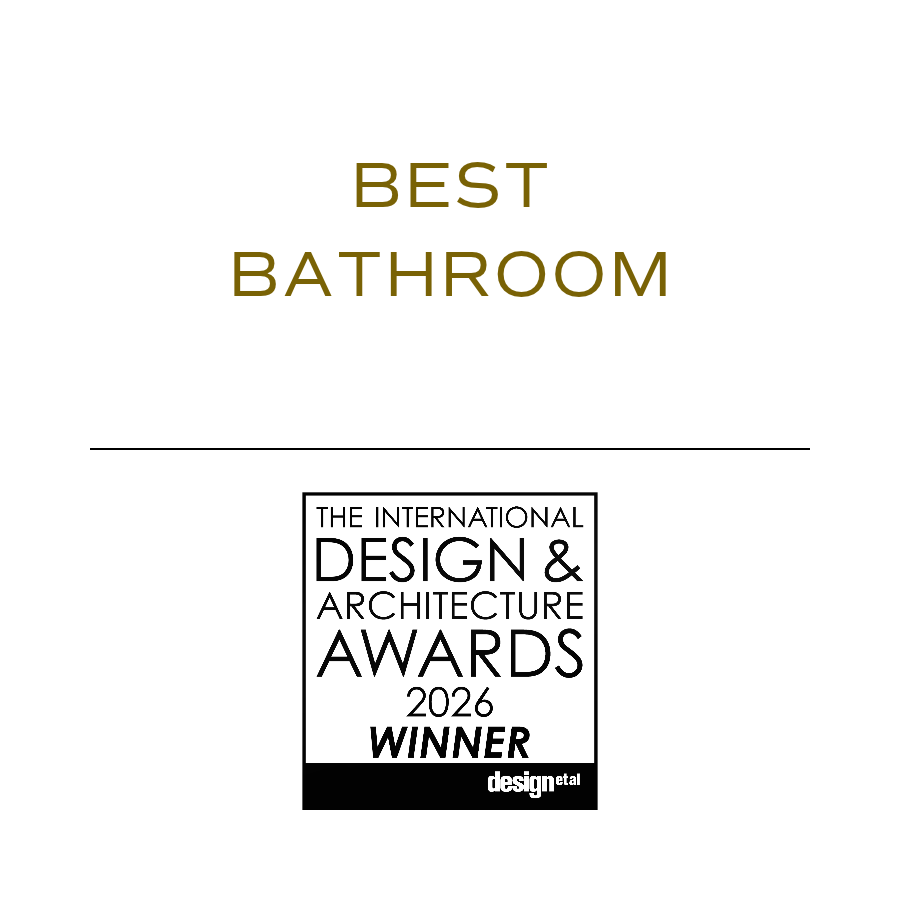 A white cover page with gold text reading 'Best Bathroom' and a black and white award logo for the 2026 International Design & Architecture Awards, labeled as the winner. Reider + Co wins Best Bathroom, Global, at international design awards